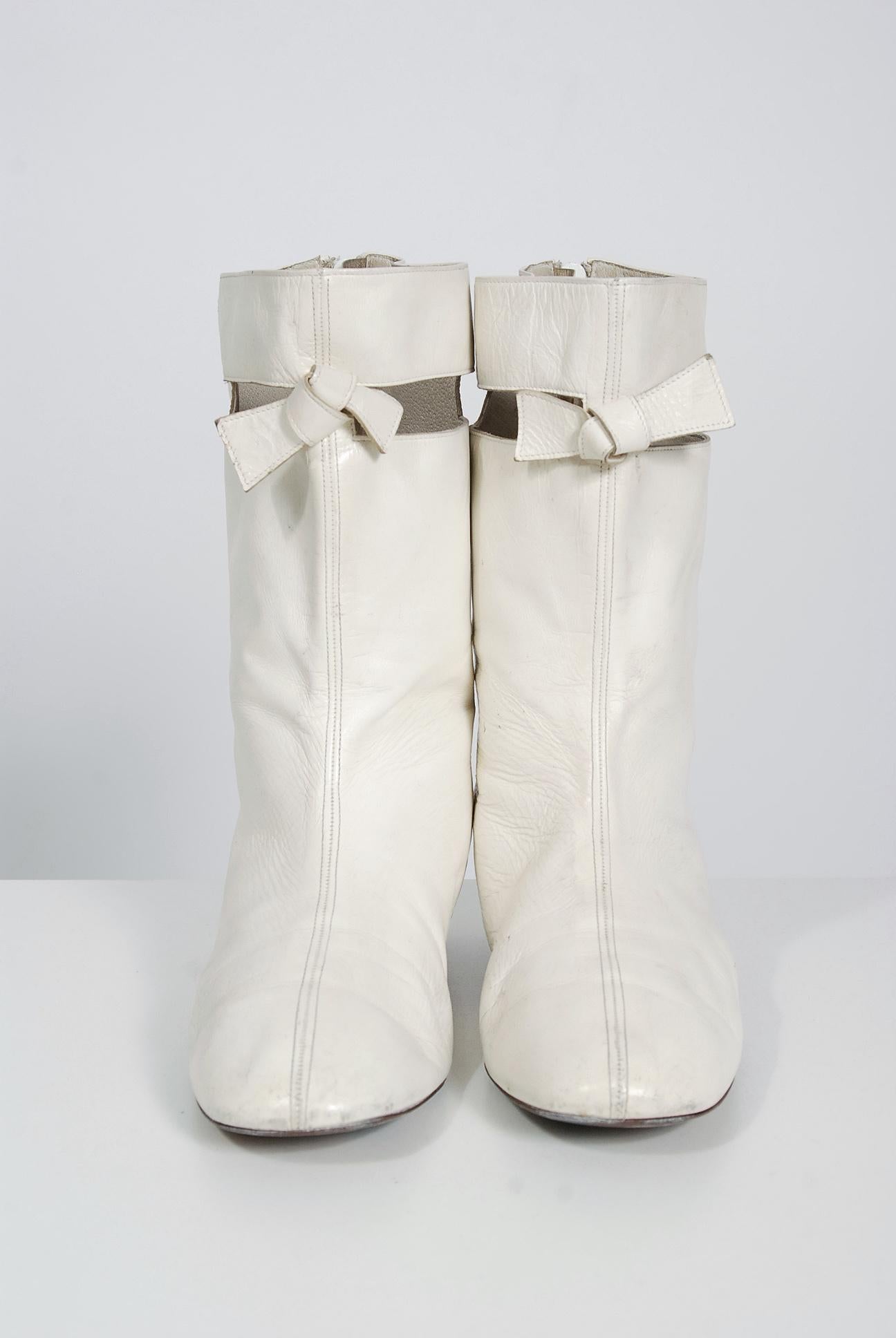 Rare Andre Courreges white leather boots from his iconic 1965 Space-Age collection. The main features of his ultra-modern, uncluttered look spread quickly throughout the fashion world, especially the miniskirt, which he introduced to France. I love