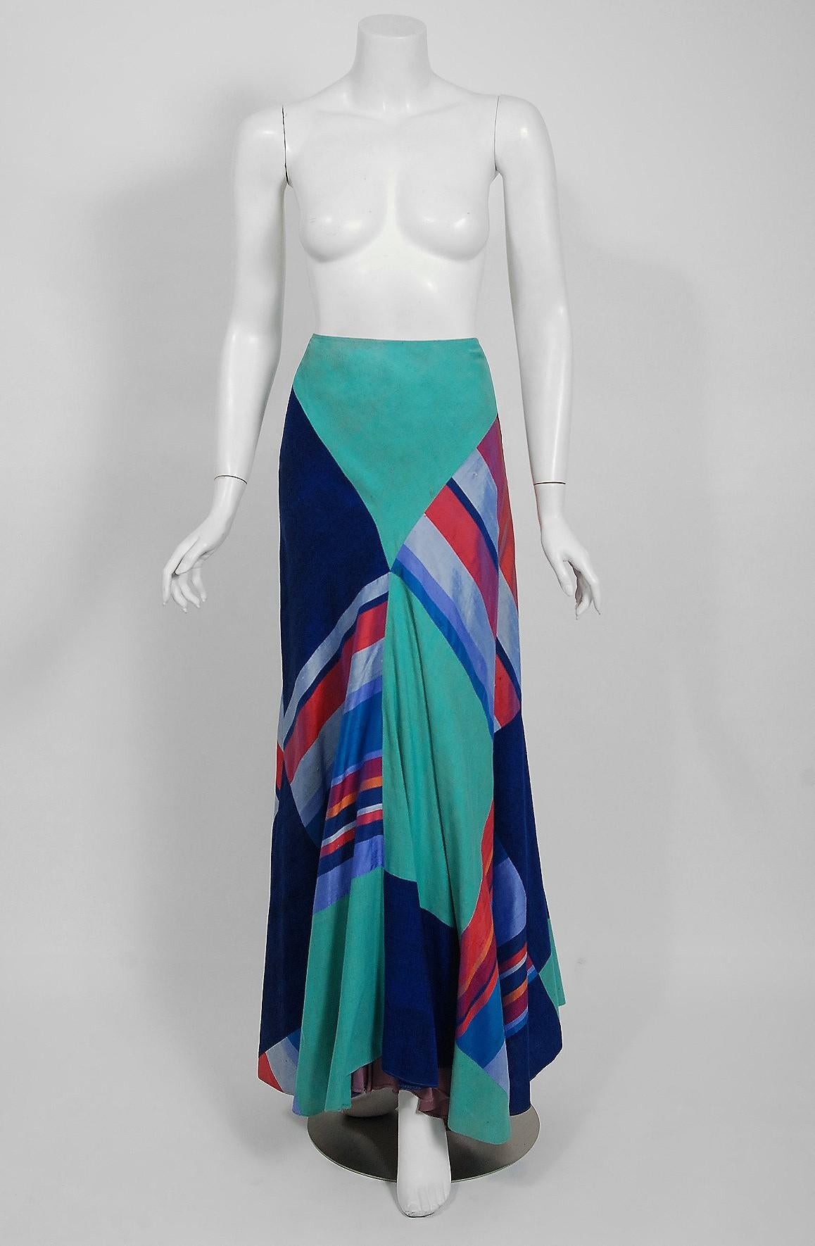 Breathtaking Thea Porter Couture maxi skirt fashioned in luxurious multi-colored silk. Just look at the decadent patchwork construction. I love the nipped waist sculpted bias-cut shape with unique asymmetric hemline. Thea Porter was largely inspired