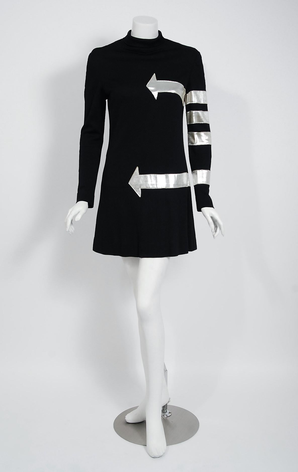 Sensational Michael Mott for Paraphernalia silver arrows novelty mod dress dating back to the late 1960's. Michael Mott was one of the few young designers hired by this chic New York boutique, starting in 1965. Taking his cues from the more