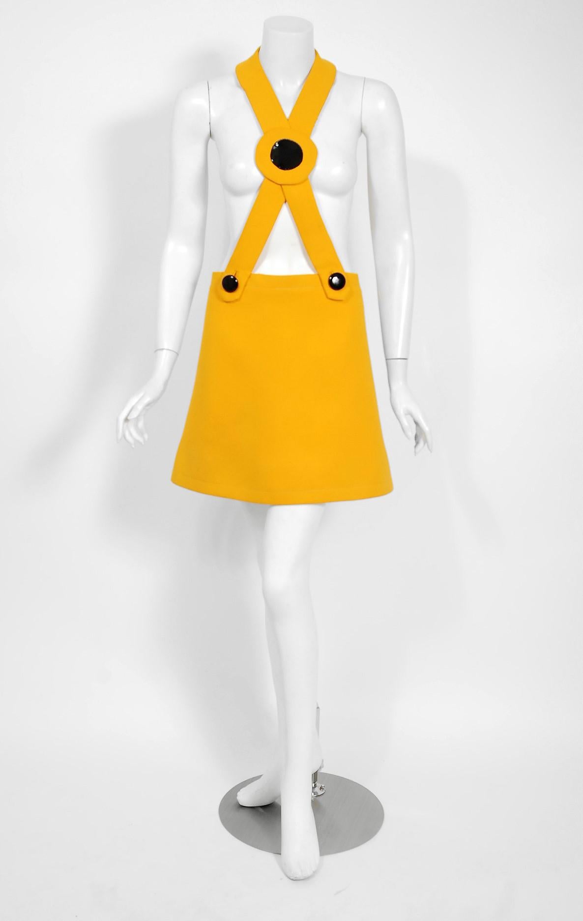 Magnificent Pierre Cardin mod pinafore dress in a vibraint marigold yellow wool from his iconic 1969 documented collection. The same iconic dress is in The Metropolitan Museum of Art's permanent collection. In 1951 Cardin opened his own couture