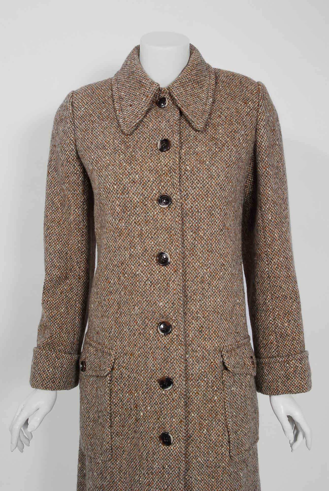 This exceptionally chic autumn brown wool-tweed trench jacket is from the infamous Rive Gauche collection during Fall-Winter 1973. Pieces from this decade are very rare and are true examples of fashion history. I adore the huge over-sized side