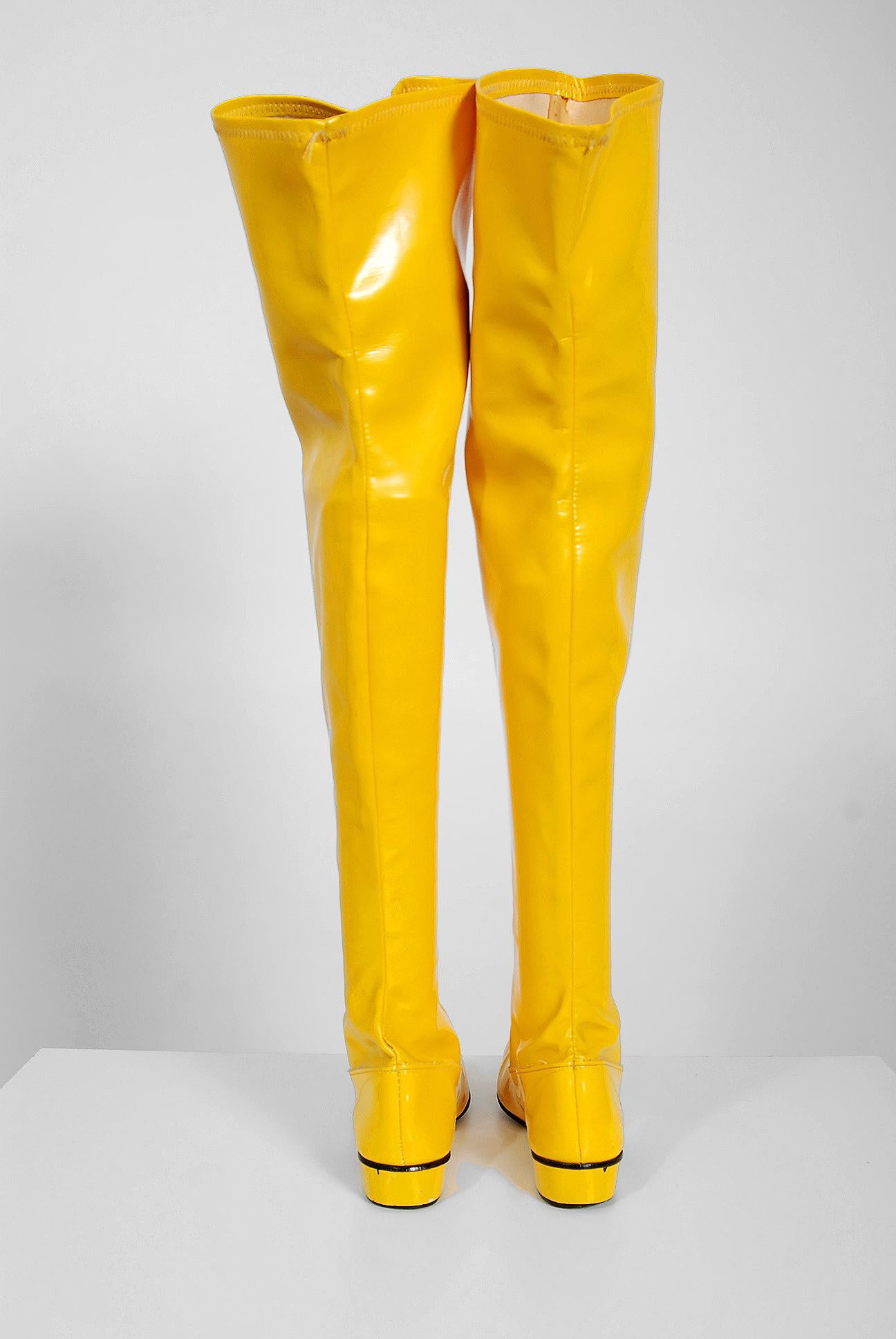 A sensational pair of sunshine yellow vinyl boots dating back to the late 1960's. I love the unique color and chic thigh-high length. Easy pull-on style and classic low space-age heel. Mod boots in a rare color like these do not come around