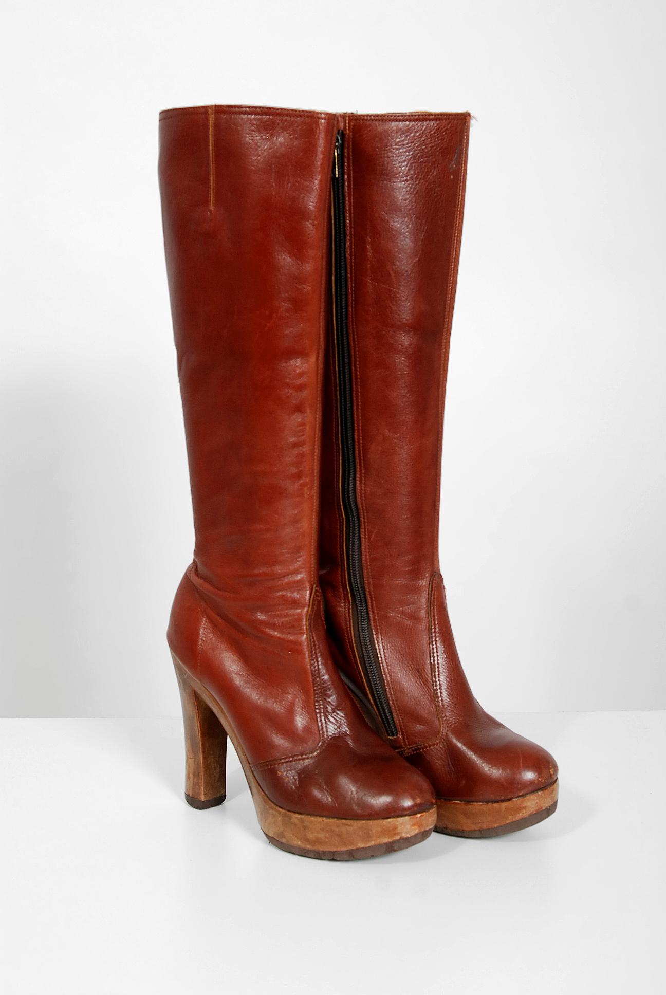 Amazing 1970's Sbicca designer leather boots in the most gorgeous sienna brown color! These boots have unbelievable stacked wood platforms with handcrafted work throughout. I love the shaped heel and seductive knee-high design. Boots like these will