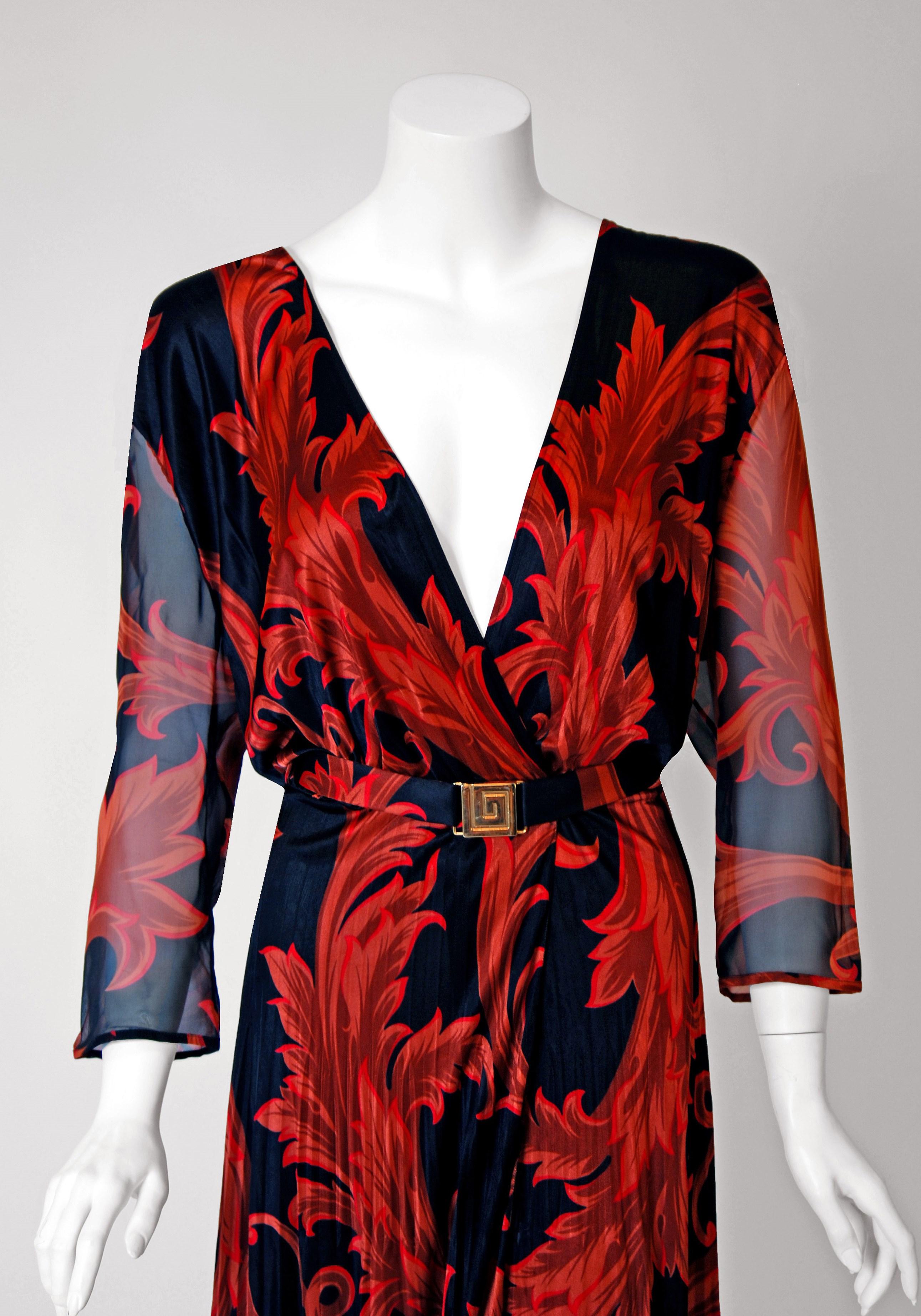 Gianni Versace redefined fashion by combining it with rock 'n' roll, art and celebrity. By merging the worlds of fashion and entertainment, his shows became pop-culture events. This iconic black & red baroque print silk number, from their 1994