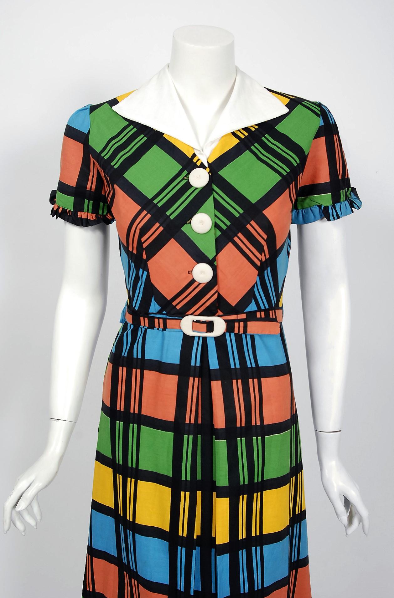 With its vibrant rainbow plaid print and flawless styling, this 