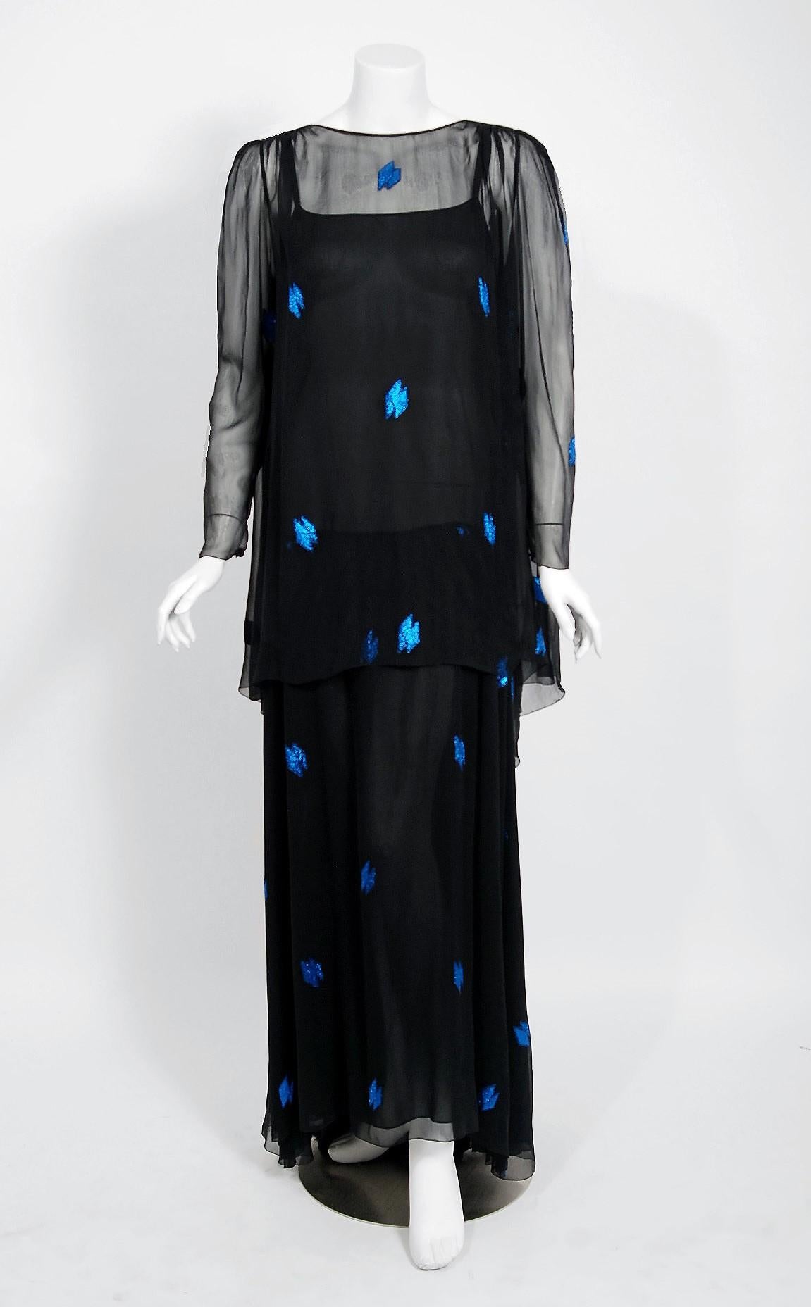 A gorgeous Christian Dior Paris black and sapphire blue show-stopper dating back to their 1972 collection.  When the talented Marc Bohan took over as head designer in 1960, he continued the Dior tradition of elegant design and this beautiful