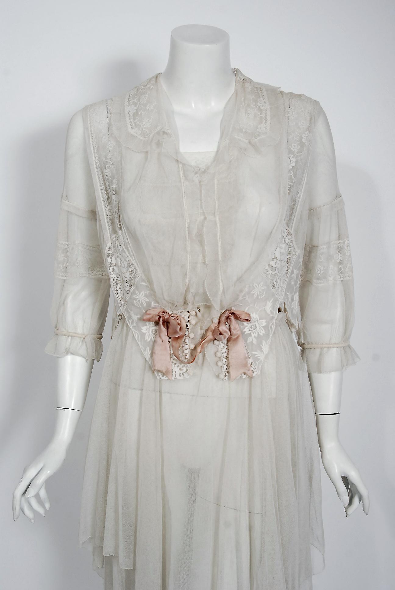Romantic white dresses from the early 20th century are perennial favorites and this one is a show-stopper. The garment's complete couture style is so modern; the fine fabrics are a treasure trove of needle art. The dress is made up of four different