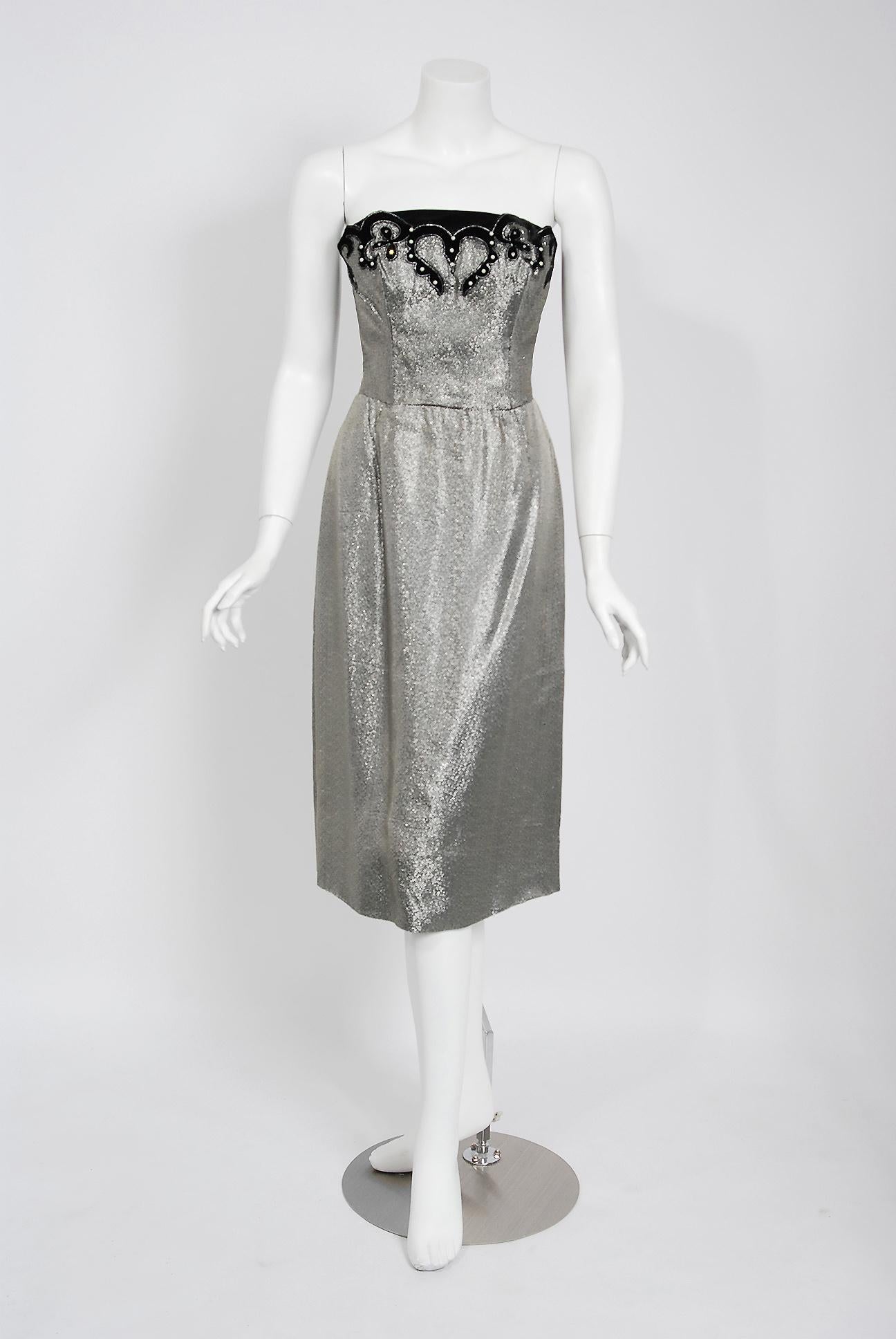 A seductive and highly stylized 1950's sparkling silver lamé dress ensemble by the famous Lilli Diamond label. The silhouette is classic pin-up 