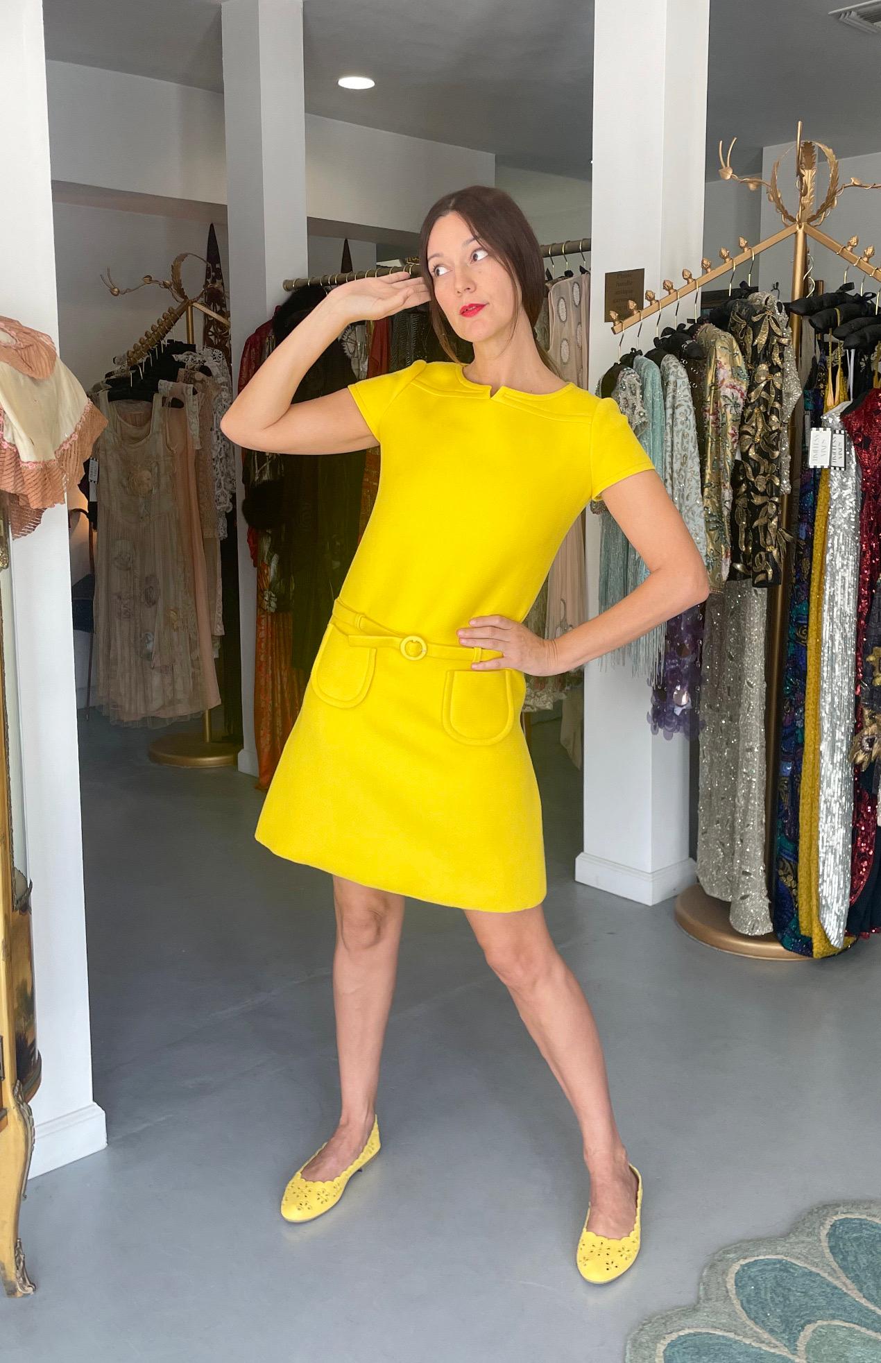 A spectacular and highly coveted André Courrèges haute couture vibrant sunshine yellow wool short-sleeve mod dress dating back to his 1968 fall/winter collection. As shown, the same dress in grey is archived at the FIT Museum and was apart of their