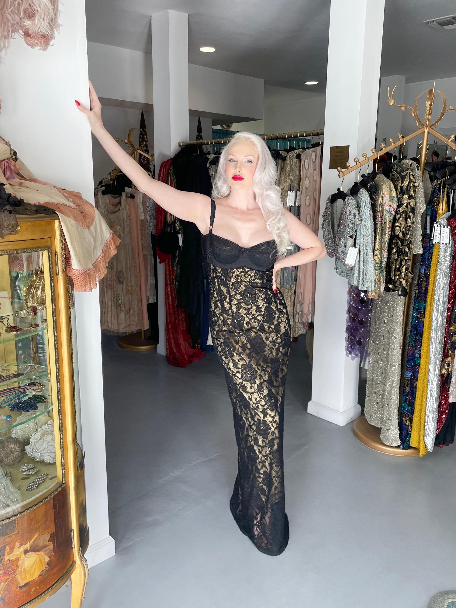 An instantly recognizable and ultra seductive Dolce & Gabbana sheer black stretch cotton-lace full length slip dating back to their coveted 1997 spring/summer collection. As pictured, Madonna wore a gown from the same collection when winning Best