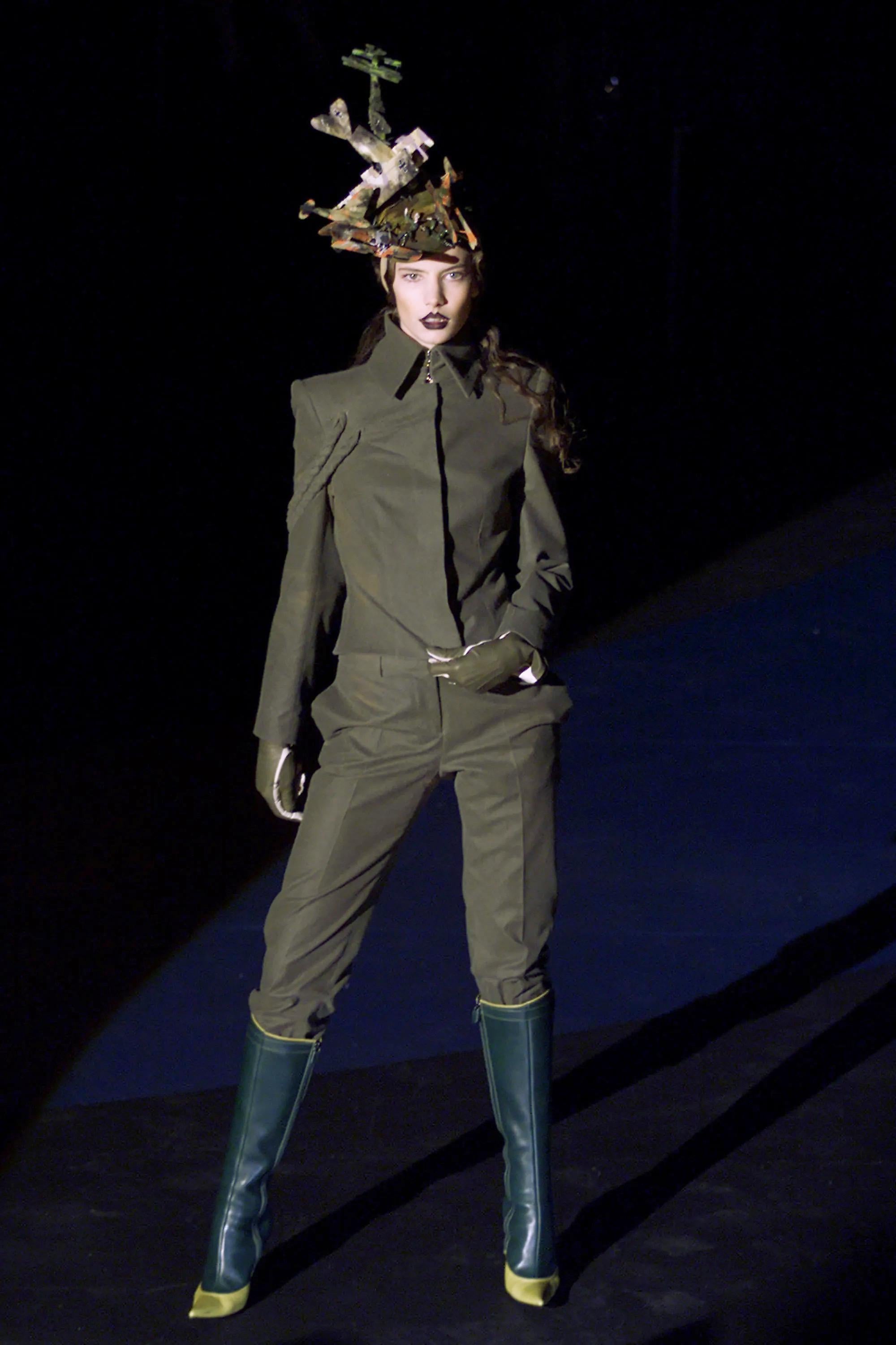An incredibly chic and highly coveted Alexander McQueen moss green wool braided-jacket pantsuit dating back to his incredible 2001 fall/winter documented collection. This highly stylized yet effortless set, look #2 on the runway, is a perfect