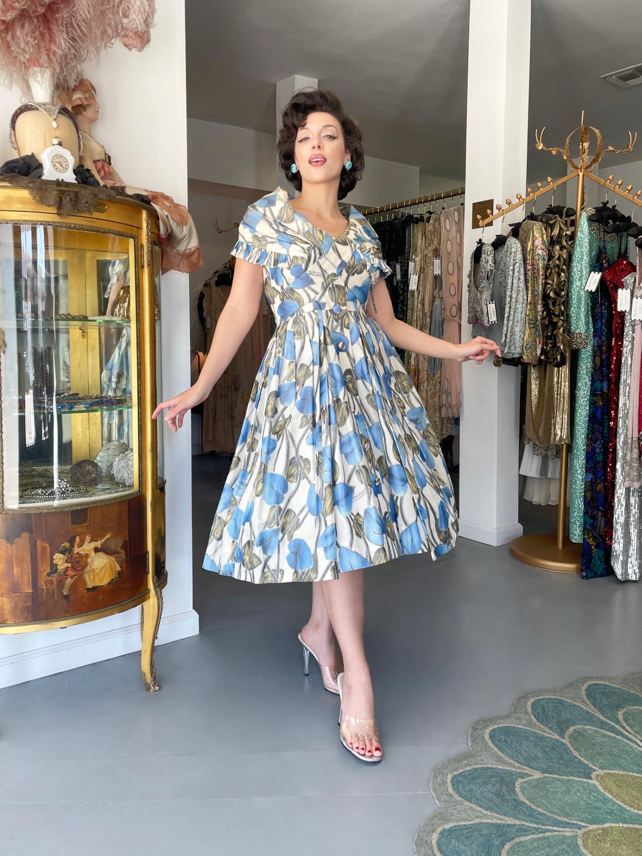 This is a ultra rare and highly coveted Christian Dior floral 'New Look' dress dating back to his lifetime 1956 spring/summer collection. The House of Dior has been an enduring icon of haute couture. While the House of Dior is still a thriving