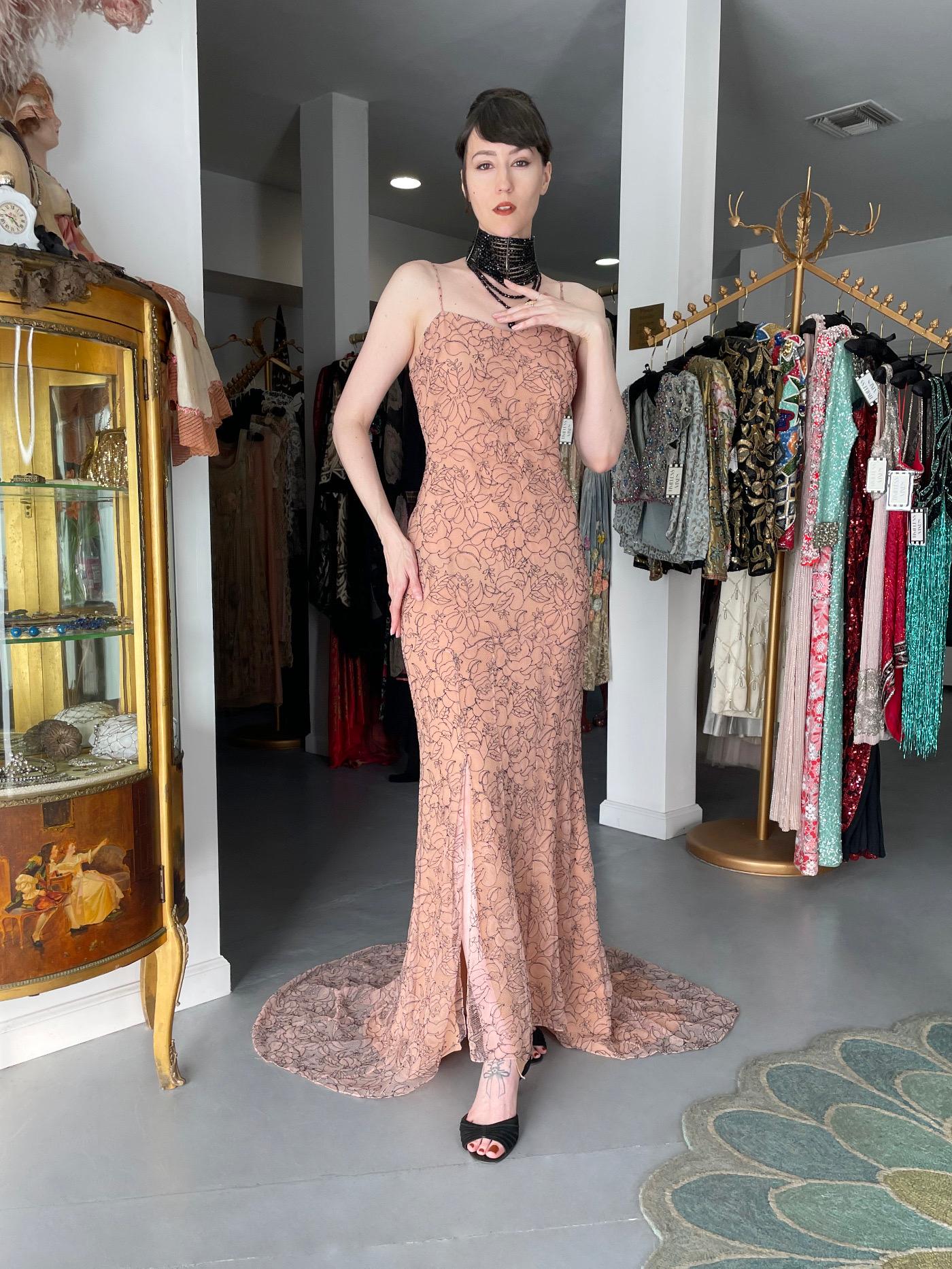 An incredibly chic and highly coveted Christian Dior nude illusion floral lace lingerie gown from John Galliano's stunning 2006 spring-summer collection. This collection focused on bringing what’s underneath to the surface. He printed corsets,