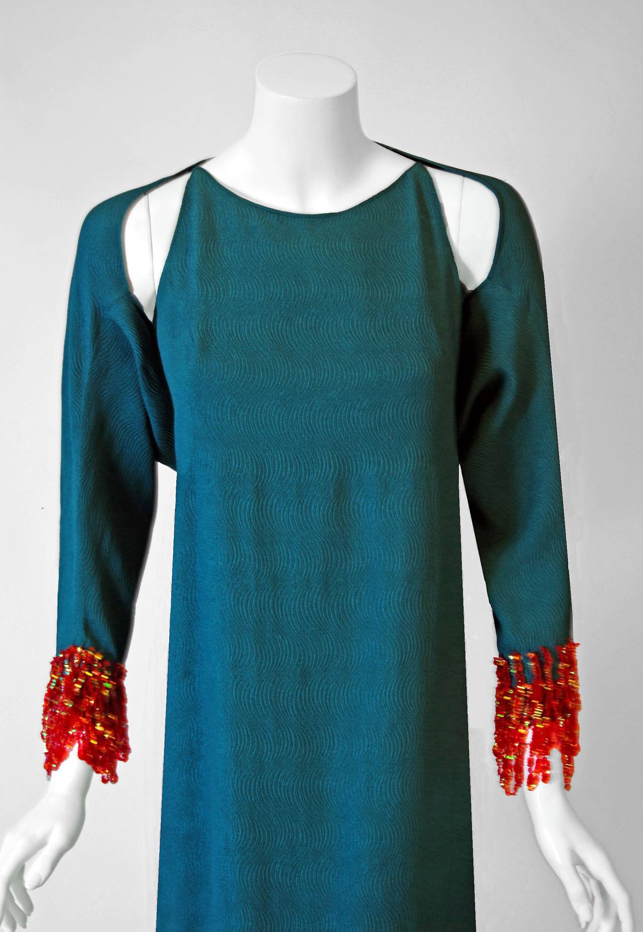 Spectacular 1966 Pierre Cardin haute-couture designer cocktail ensemble in the prettiest teal wave-textured silk. In 1951 Cardin opened his own couture house and by 1957, he started a ready-to-wear line; a bold move for a French couturier at the