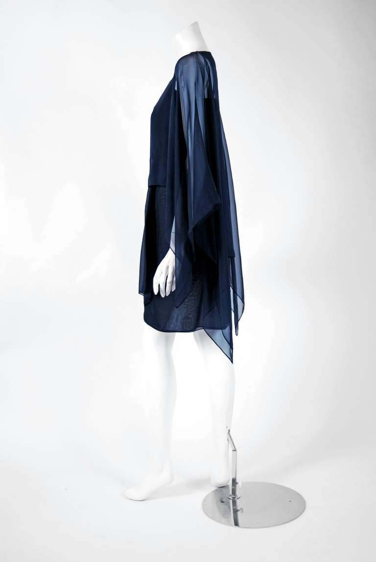 Breathtaking navy-blue pure silk-chiffon two piece dress from the infamous Rive Gauche collection during the mid-1970's. Pieces from this decade are very rare and are true examples of fashion history. I adore the playful Grecian angel-sleeves and