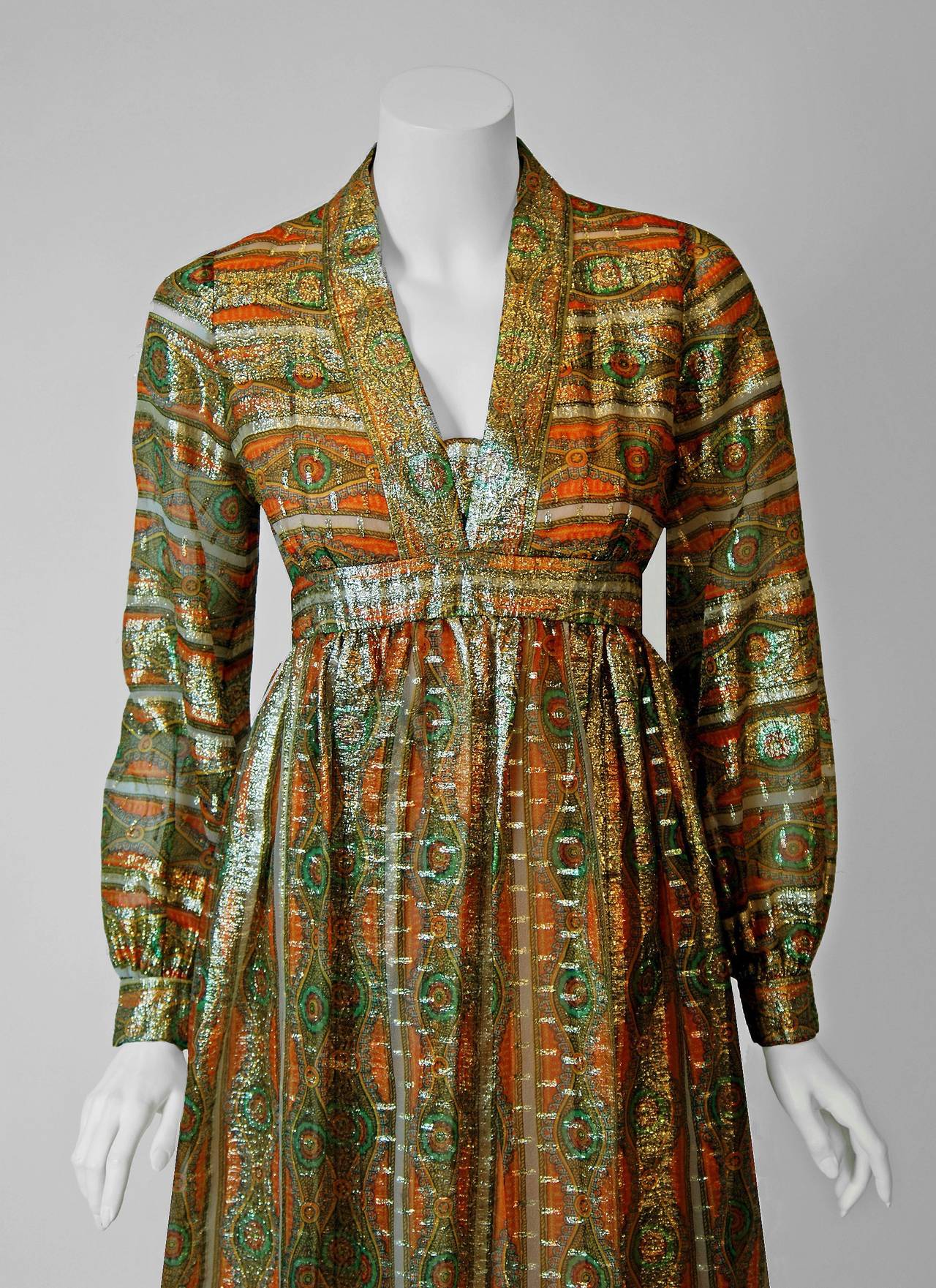 Gorgeous 1970's Indian metallic art-nouveau inspired print silk dress from the high-end Houston boutique, Esther Wolf. The luxurious fabric is lightweight and effortless to wear. The fabric used for this garment is so sensational, it shimmers with