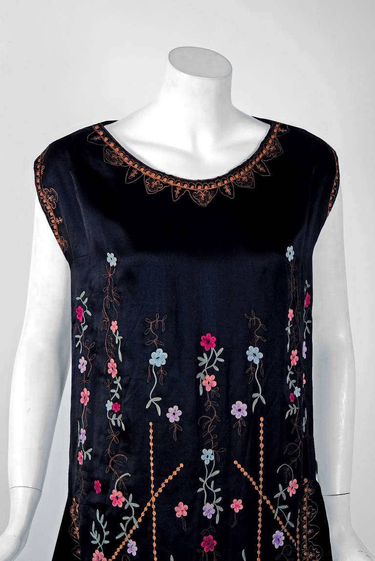 Breathtaking 1920's museum quality silk-satin evening dance dress. The ethereal colorful floral pattern touches a deep chord in our collective aesthetic consciousness. As fashion lovers, we never tire from metallic embroidery; it will always be