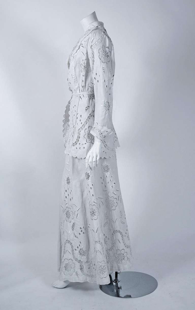 This breathtaking Edwardian couture walking suit is in a class of its own. The detailed construction and meticulous attention to detail are comparable to what you will find in modern day haute-couture. The exquisite crisp-white linen embroidered