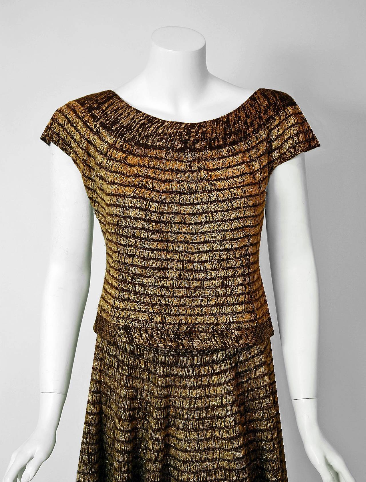 1940's Austrian hand-knit stretch garments are in a class of their own. They are always fit to flatter the figure and have a certain timeless quality. This treasure has a fantastic metallic-gold striped shimmer worked into the rich chocolate brown