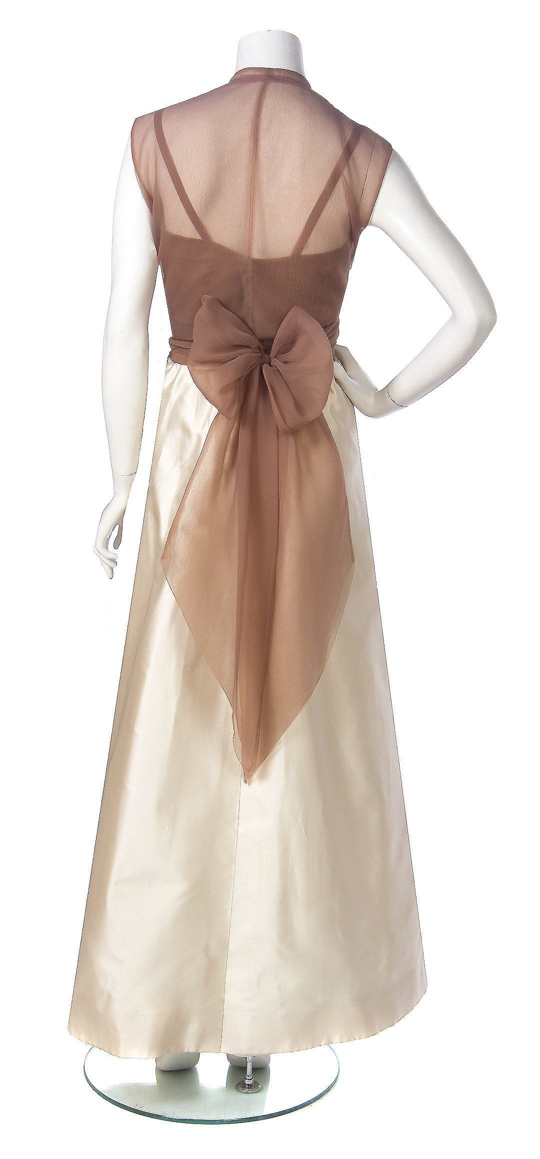 Stunning ivory dupioni-silk & nude crepe-chiffon evening gown from the 1967 Balenciaga collection. Cristobal Balenciaga began his life's work in fashion at a very young age. It is fabled that the Marquesa de Casa Torres, who was so taken with his