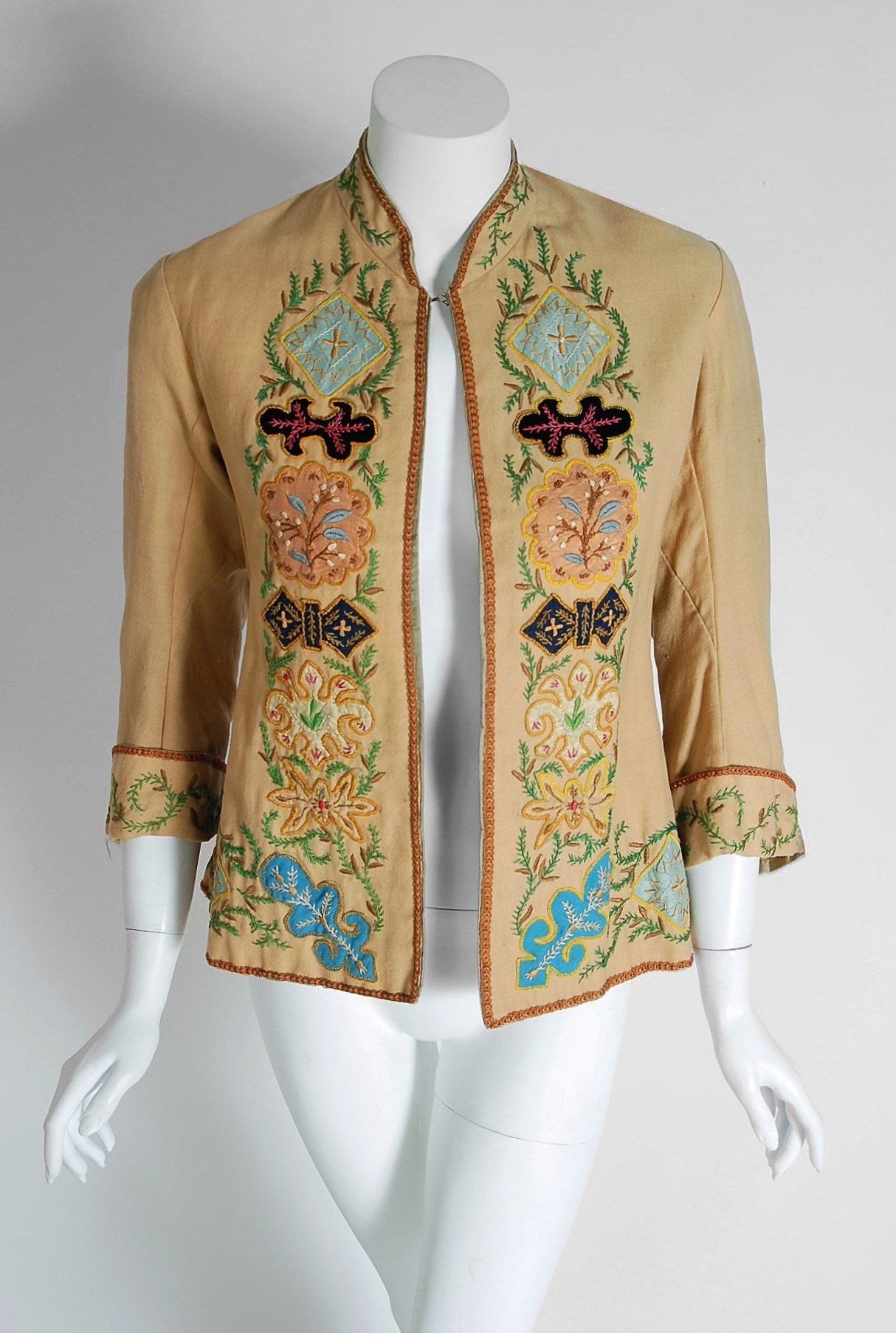 This breathtaking Victorian couture jacket, dating back to the 1870's, is in a class of its own. The detailed construction and meticulous attention to detail are comparable to what you will find in modern day haute-couture. The exquisite colorful