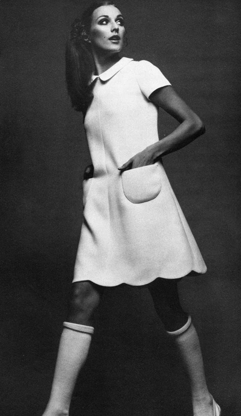 Andre Courreges launched his Space-Age collection in 1964. The shapes of his clothes were geometric: squares, trapezoids, triangles. The main features of his ultra-modern, uncluttered look spread quickly throughout the fashion world, especially the