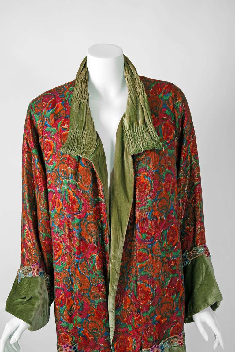 This breathtaking and unbelievable French metallic floral-garden lame & moss-green appliqued silk-velvet coat will make any woman shine during the upcoming Autumn months.The care to hand-bead the floral trimming after carefully selecting matching
