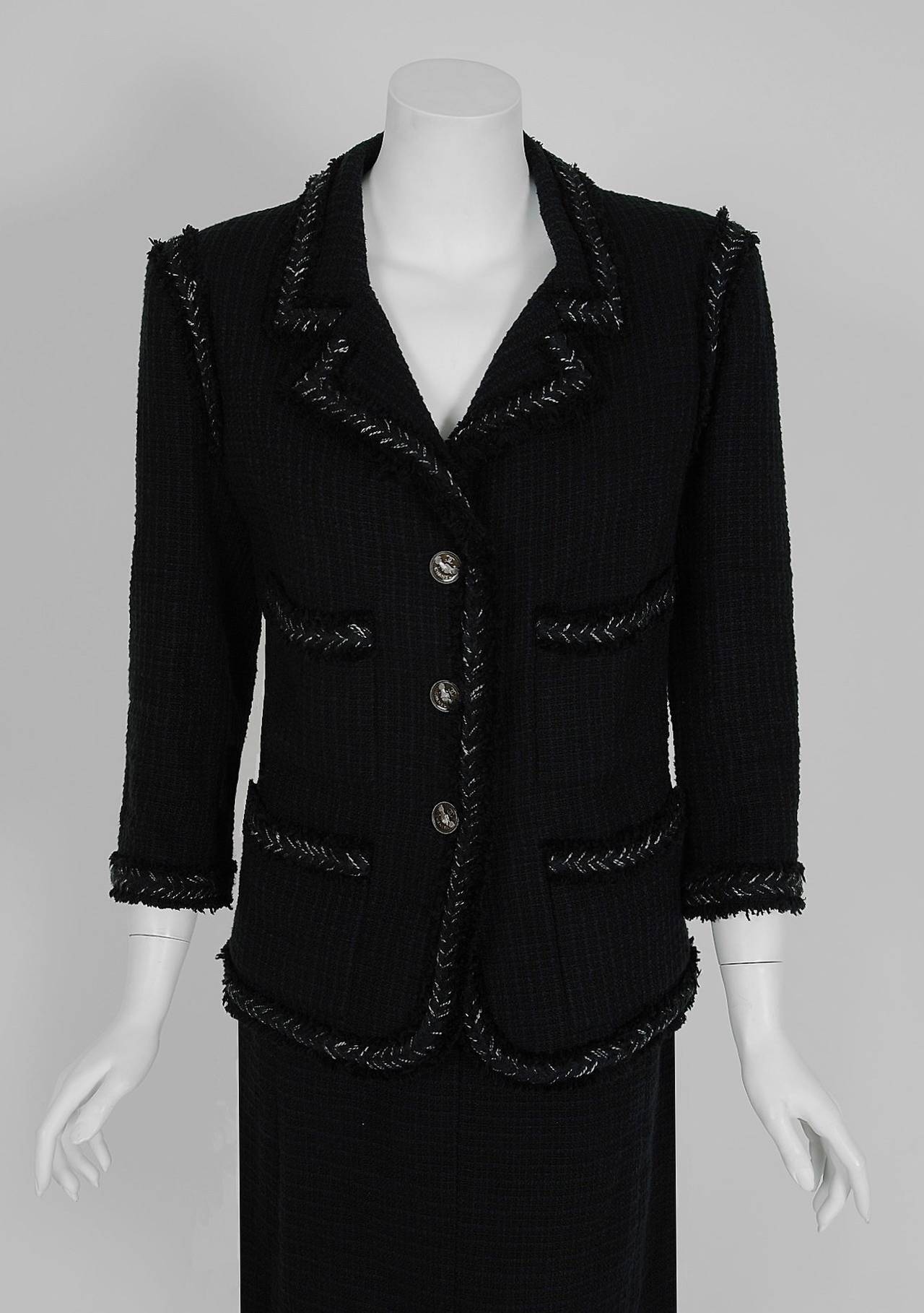 Breathtaking Chanel fall season runway ensemble which retailed for over $7,000 in 2008! Chanel is known to be one of the most luxurious and decadent fashion houses in the world. This gorgeous black woven boucle-wool suit is a perfect example of why