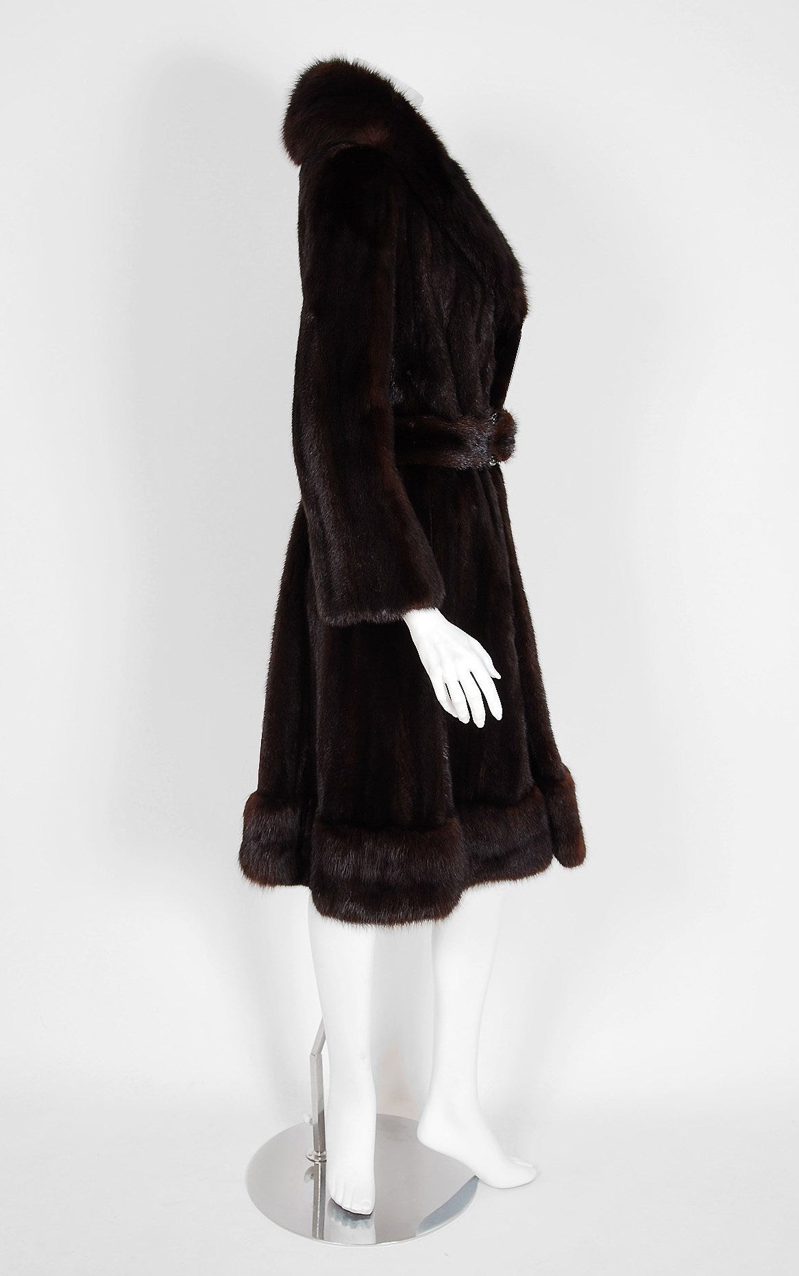 This luxurious 1960's Pierre Cardin couture genuine ranch-mink and sable coat will make any woman shine during the upcoming cold winter months. The soft mink been worked into clean vertical panels and the effect is really breathtaking. The care to