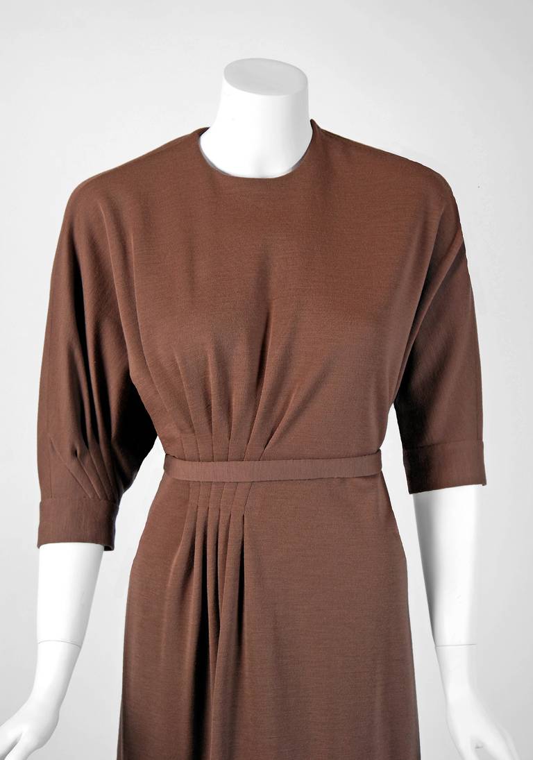 Madame Gres felt that the true job of the couturier was not to create a name for one's self, as many designers do, but to pay rigorous attention to the clothing. This stunning taupe wool cocktail has so much detail, you can tell it was made with