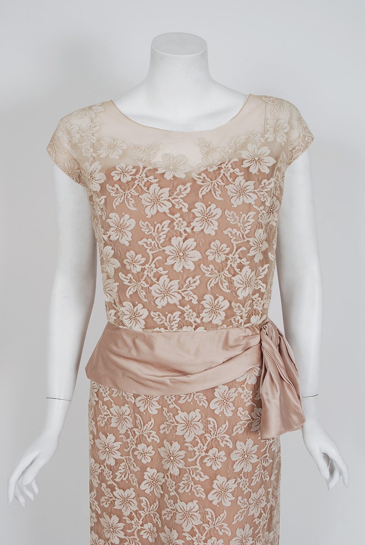 An amazing and highly stylized 1950's cocktail dress by the famous American designer Peggy Hunt. Starting in the 1930's through the early 1960's, she was immensely successful with her specialized cocktail and evening dresses. Her garments were often