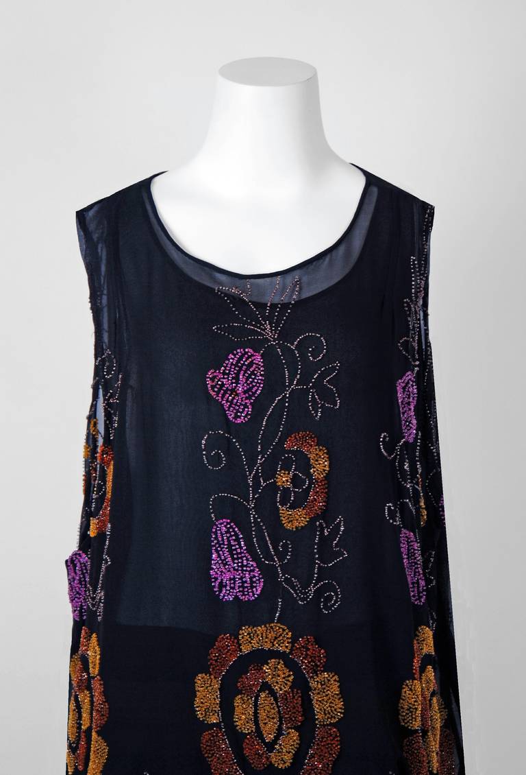 Breathtaking 1920's museum quality silk-chiffon evening dance dress. The ethereal colorful floral pattern touches a deep chord in our collective aesthetic consciousness. As fashion lovers, we never tire from antique beadwork; it will always be fresh