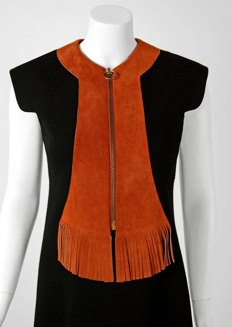 Spectacular mid 1960's Pierre Cardin designer dress in rich black wool-knit & brown genuine leather-suede. In 1951 Cardin opened his own couture house and by 1957, he started a ready-to-wear line; a bold move for a French couturier at the time. The