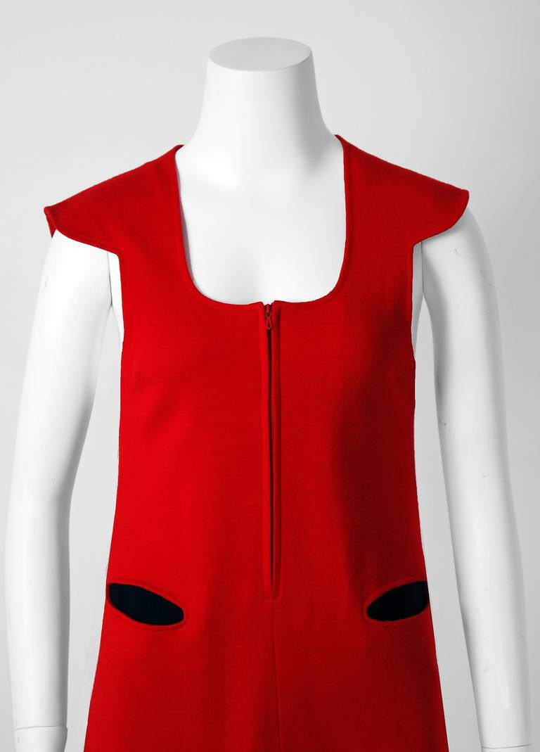 Marvelous mid 1960's Pierre Cardin designer mini tunic dress in rich ruby-red & black wool-knit. In 1951 Cardin opened his own couture house and by 1957, he started a ready-to-wear line; a bold move for a French couturier at the time. The look most