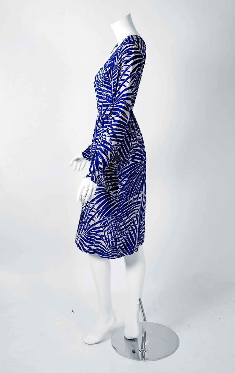 Chic Yves Saint Laurent blue and white palm-tree print silk dress from the infamous Rive Gauche collection during the mid-1970's. Pieces from this decade are very rare and are true examples of fashion history. From the collection that Yves drew