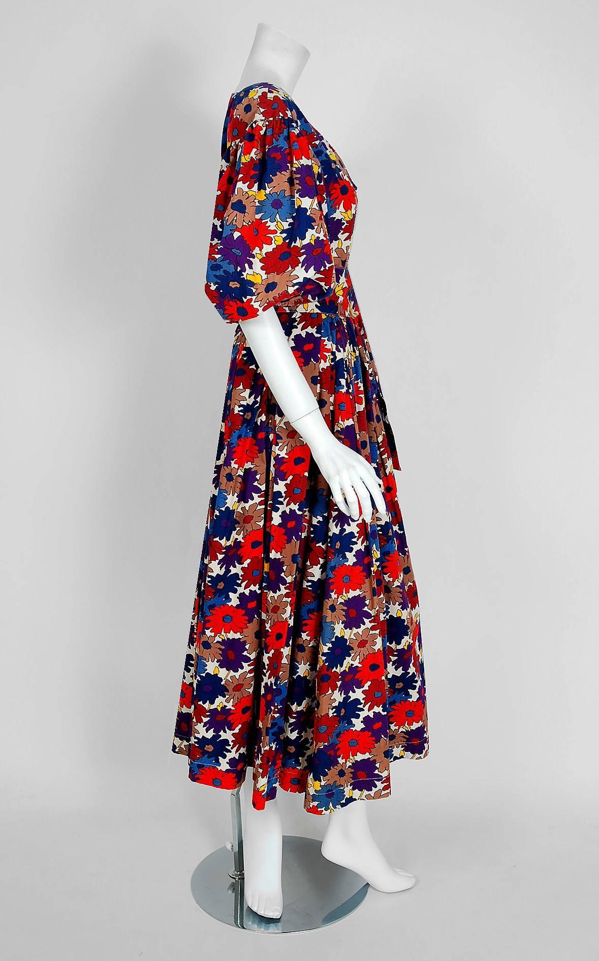 Breathtaking Yves Saint Laurent colorful floral garden print cotton ensemble from the infamous Rive Gauche collection during the mid-1970's. Pieces from this decade are very rare and are true examples of fashion history. I adore the low plunge