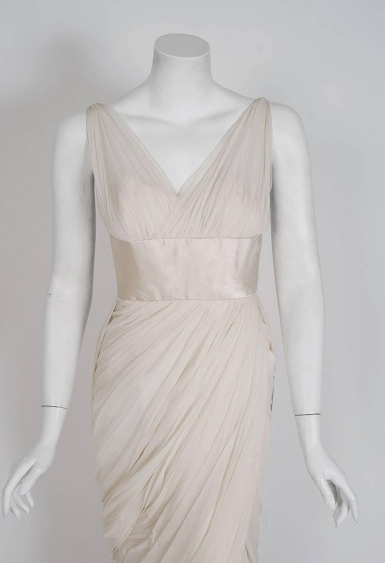 Jean Desses is one of the most important designers of the 20th century and was a designated Haute Couture house under the official Chambre Syndicate de la Couture. This exquisite 1950's goddess gown is a rare design made for the American market
