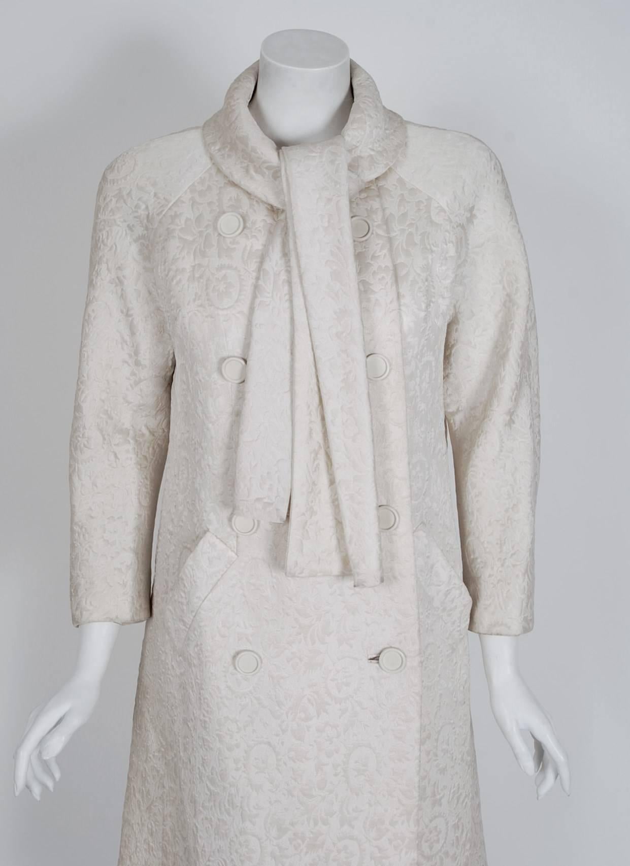 This Jean Patou ivory-white textured silk coat, in the most beautiful silhouette, is pure couture perfection. Jean Patou's affinity for tailored design and elaborate materials is wonderful for the modern woman. Not only is this garment very
