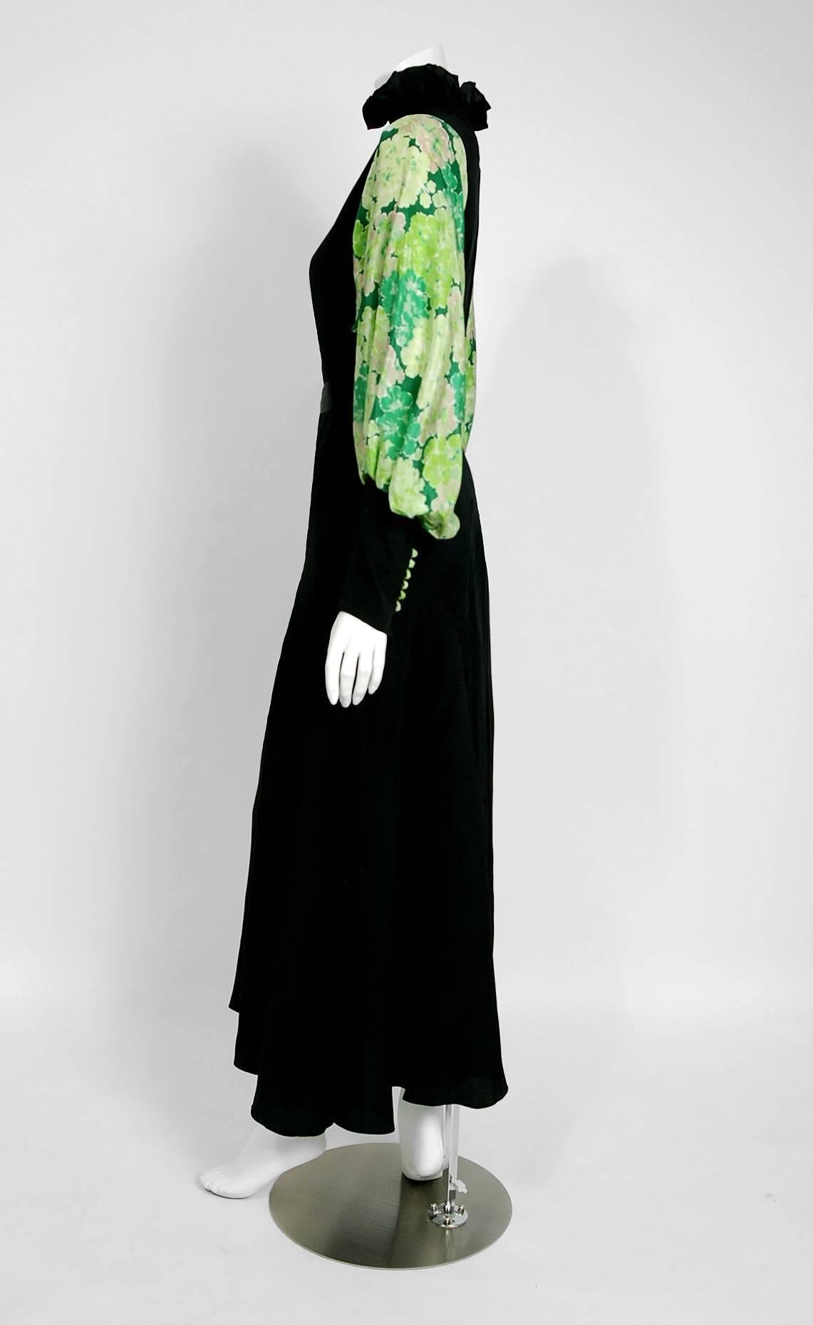 Beautiful 1930's French custom-made sculpted deco gown fashioned in luxurious black and green floral print mid-weight silk. I love the smocked ruffle collar which flows into the most flattering belted hourglass. The sleeves are so unique; a billow