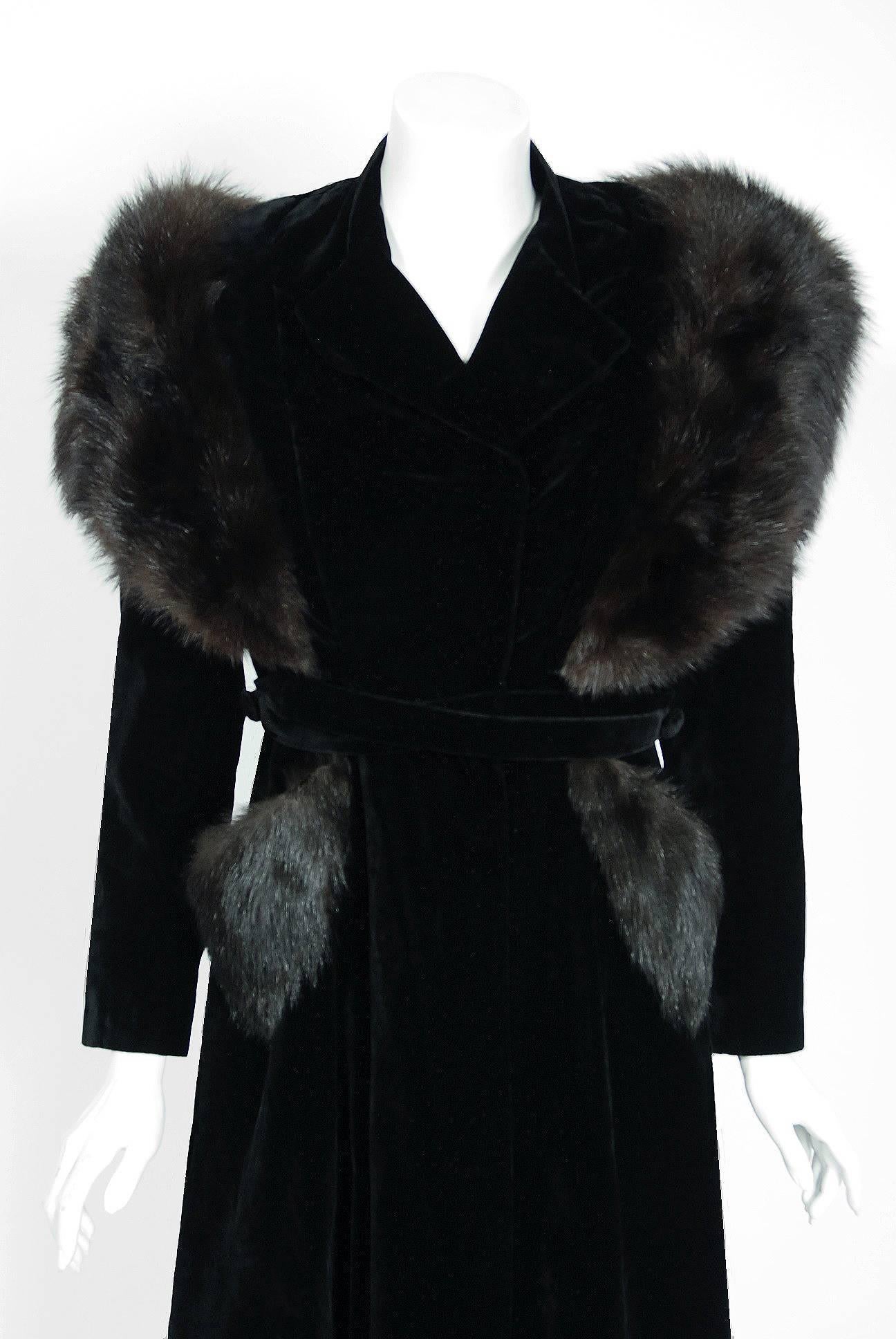 Breathtaking early 1940's A.W.B Boulevard designer coat in the most fabulous black silk-velvet and genuine fox-fur combination. The construction is impeccable and has the type of seamed pattern work one rarely sees today. The garment has the most