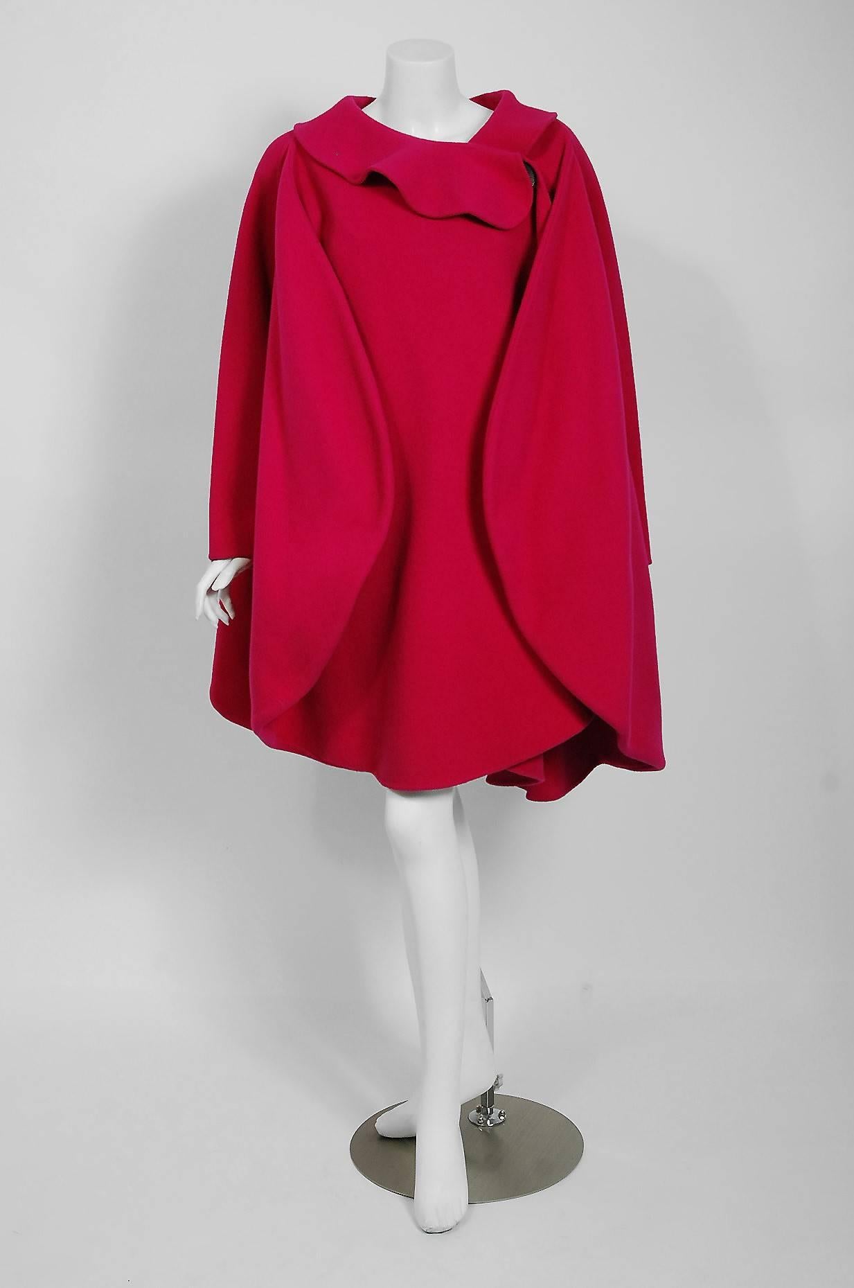 Spectacular 1987 Pierre Cardin Haute-Couture documented coat in the prettiest magenta pink color. In 1951 Cardin opened his own couture house and by 1957, he started a ready-to-wear line; a bold move for a French couturier at the time. Cardin is