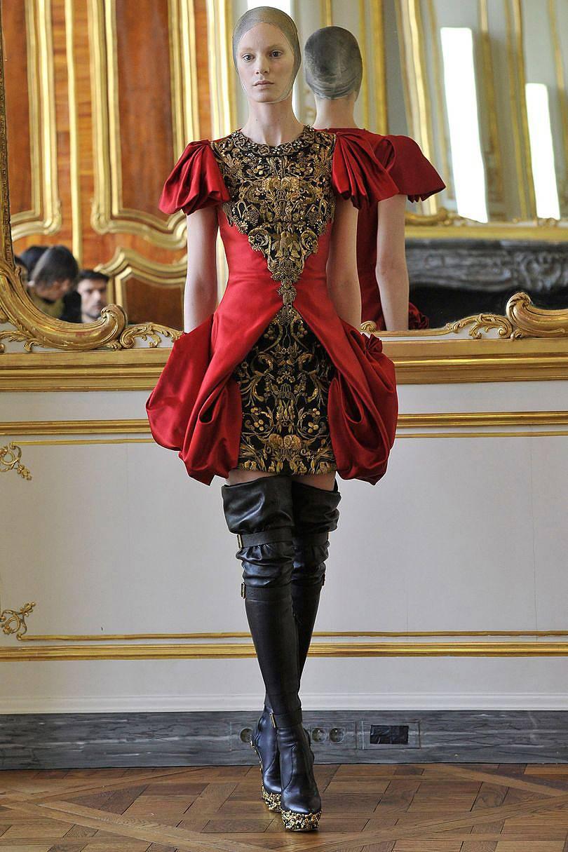 Breathtaking and important 2010 Alexander McQueen ruby-red satin bullion dress from his final runway collection. 

Alexander McQueen's final collection was consisted of only 16 pieces. McQueen referred to the collection as “Angels and Demons” in