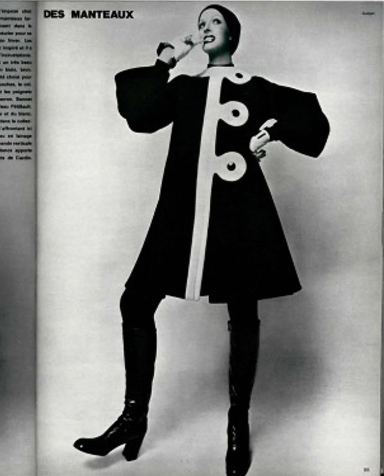 Breathtaking 1960's Pierre Cardin designer coat in a rich fully-lined black and ivory wool. In 1951 Cardin opened his own couture house and by 1957, he started a ready-to-wear line; a bold move for a French couturier at the time. The look most
