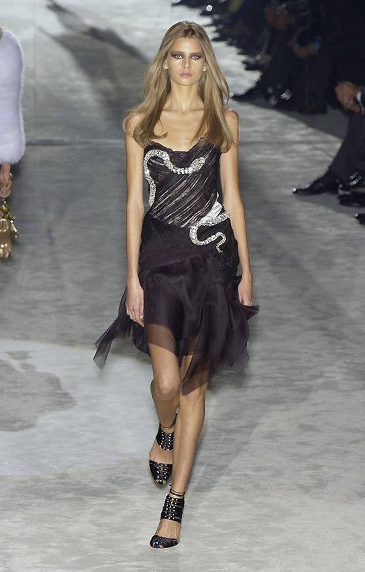 Breathtaking and extremely rare 2004 Gucci runway finale dress by famous designer Tom Ford. This iconic show-stopper is fashioned from the highest quality black silk-organza. I adore the intricate pintucking and seductive nude illusion effect. The