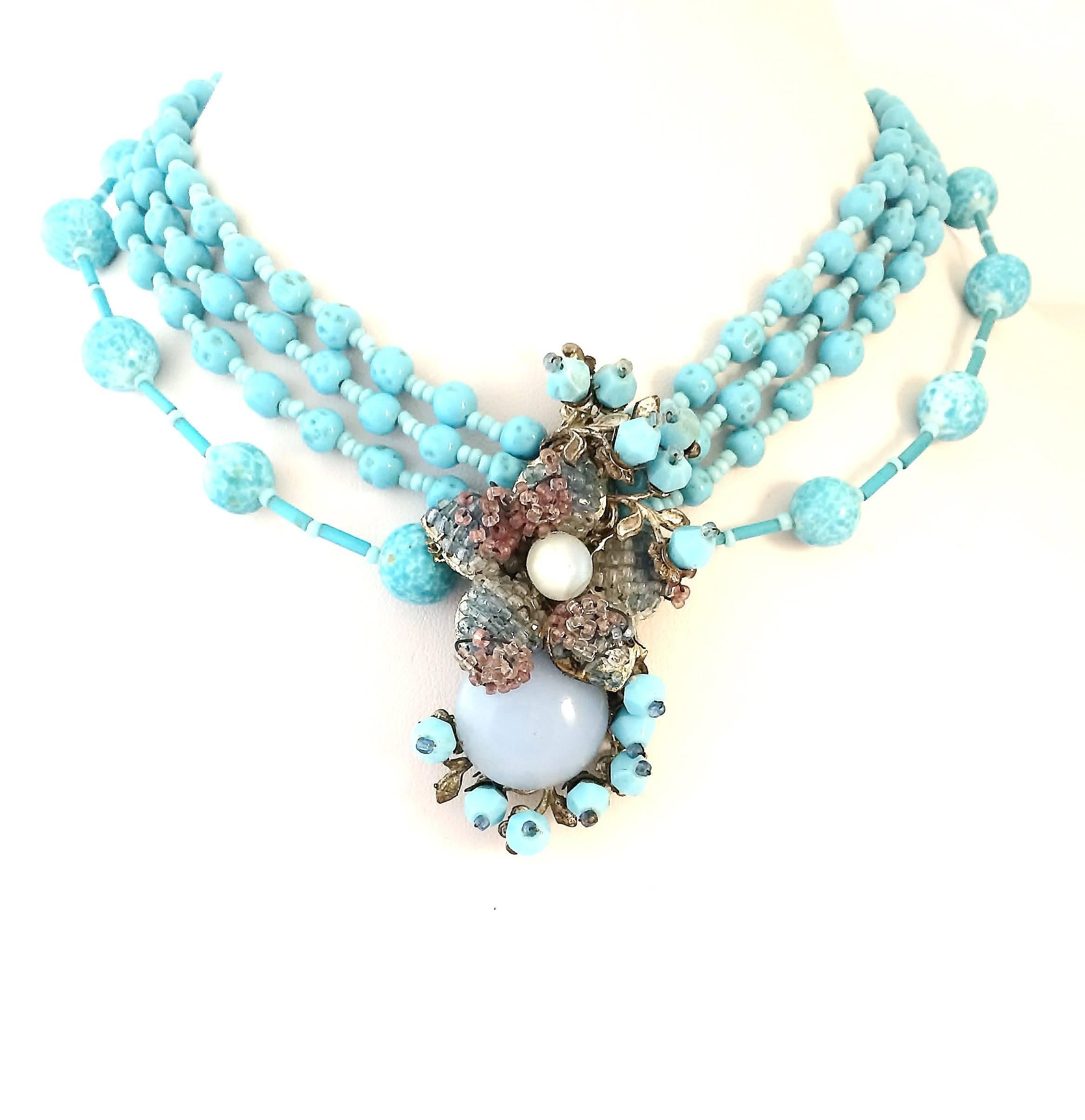 Beautiful delicate Miriam Haskell necklace, from the 1960s, made largely of marbled turquoise beads, with a centrepiece that is made of a larger and smaller moonstone cabuchon,  with a stylised flower in soft grey and amethyst glass microbeads, and