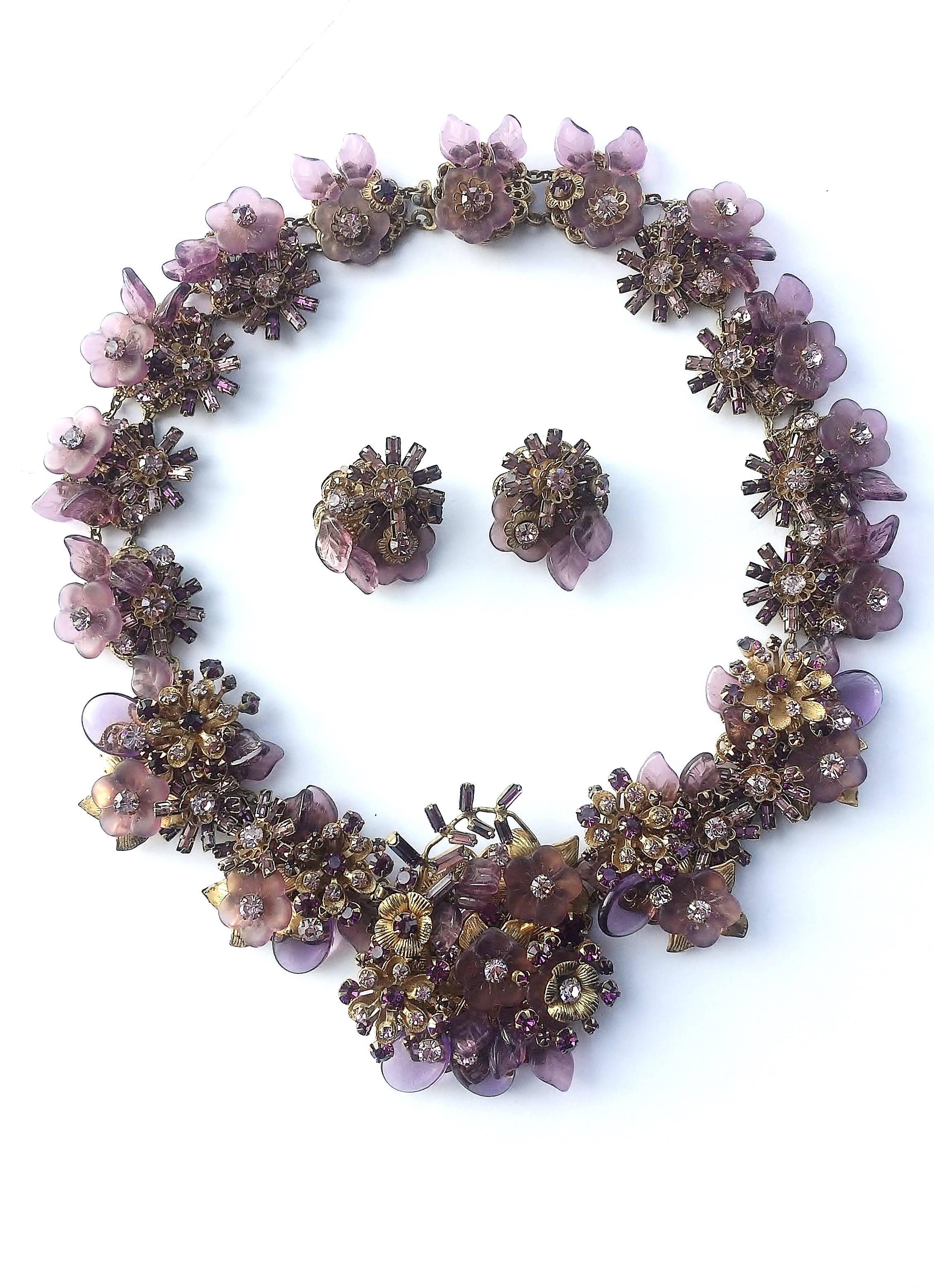 Very beautiful necklace and earrings, designed by Robert Clark for Miriam Haskell in the 1960s. Highly typical of Robert Clark designs, with intricate work and detail round the whole of the necklace, to the back, the colour is a beautiful purple,
