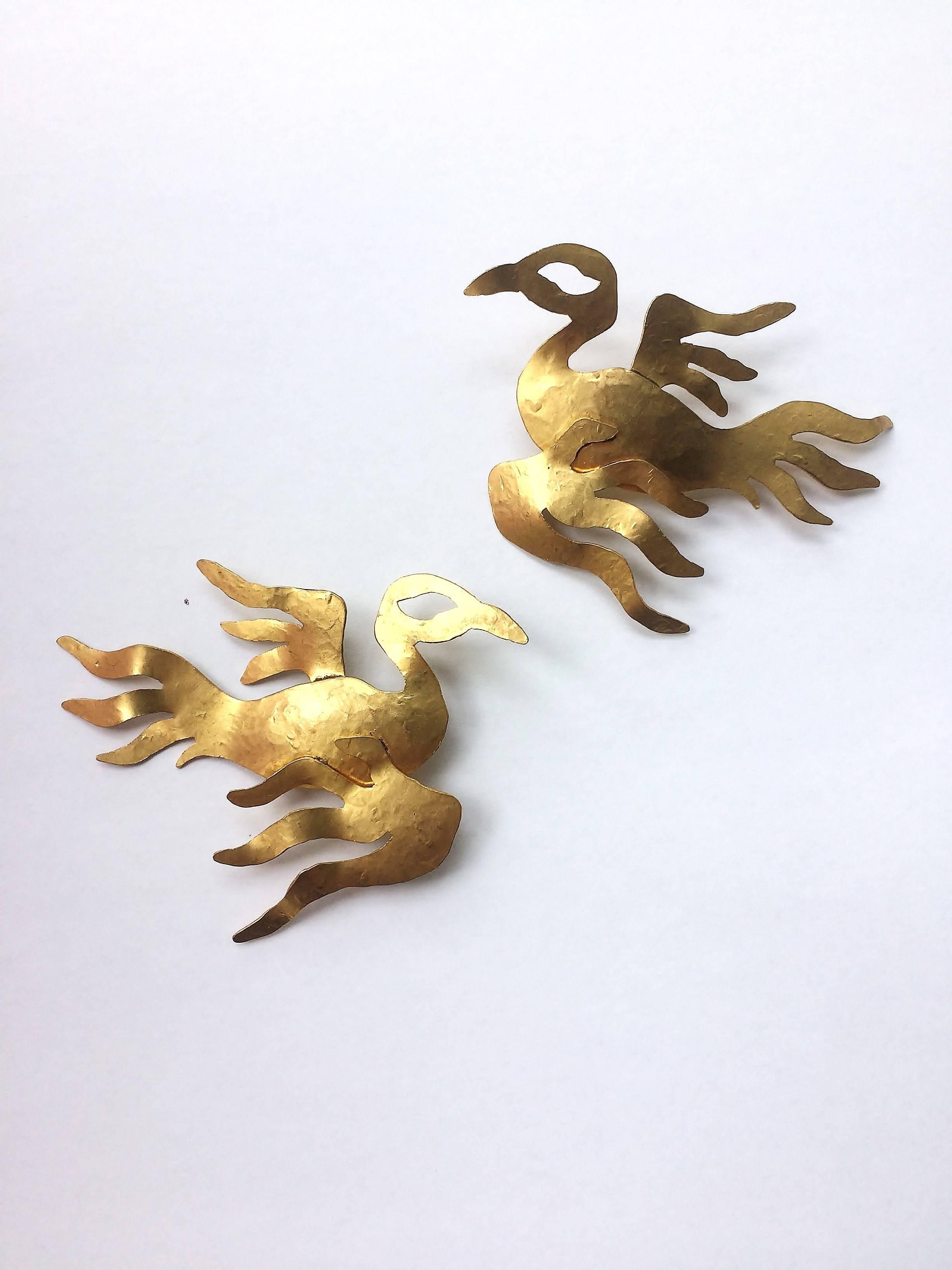 Magical gilt earrings, cut out by hand from fine gilded brass, in the form of two 'phoenix', by French artisan designer Herve Van Der Straeten. Cut out and assembled by hand, created in Paris, these are real statement earrings, resplendent, wearable