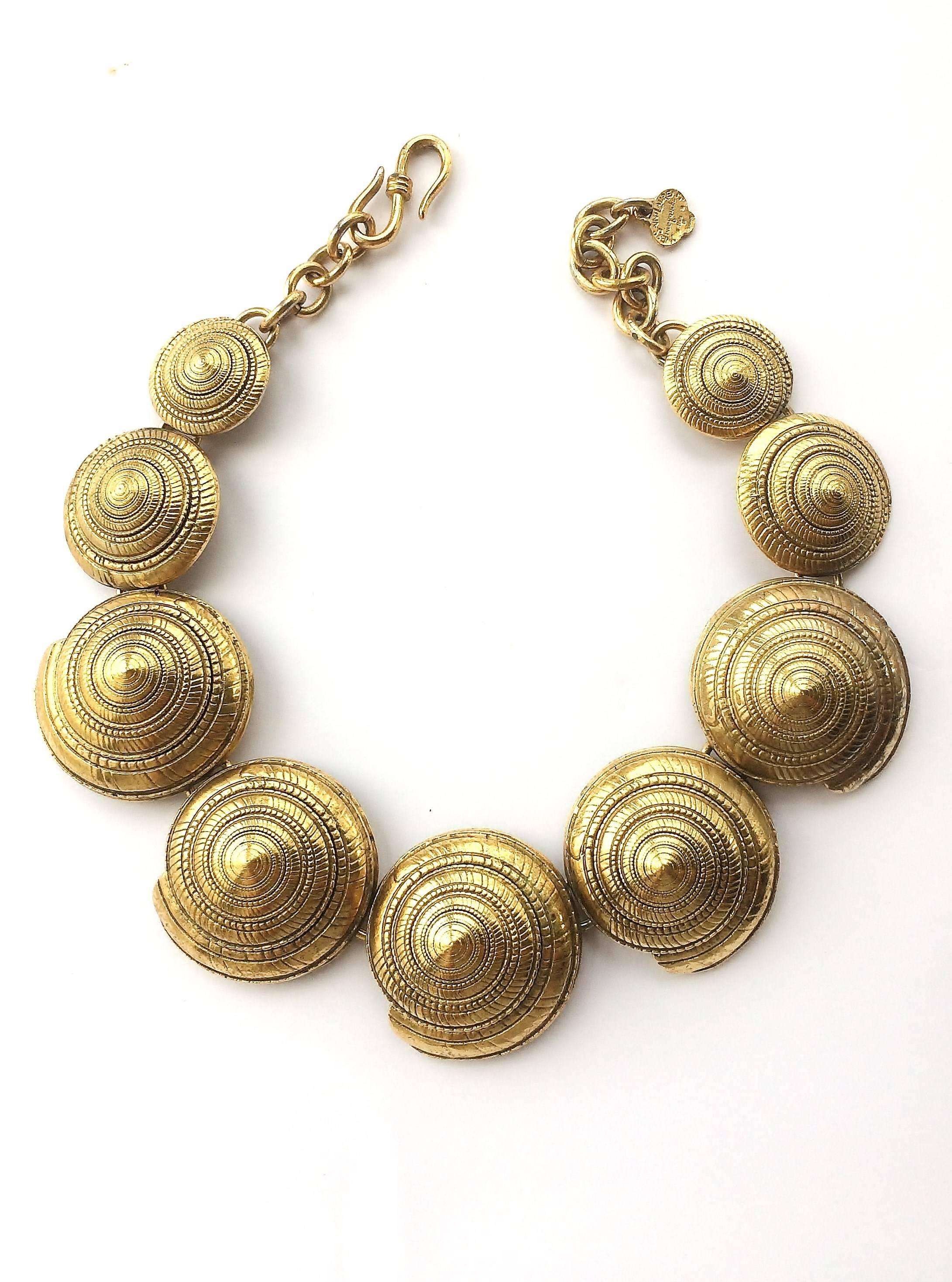 A wonderful, striking gilt metal necklace by YSL, from the mid 1980s - each 'shell' beautifully sculpted and detailed, finished off in an exquisitely burnished antique gilt. Immediately eye catching and a perfect example of the strength of design