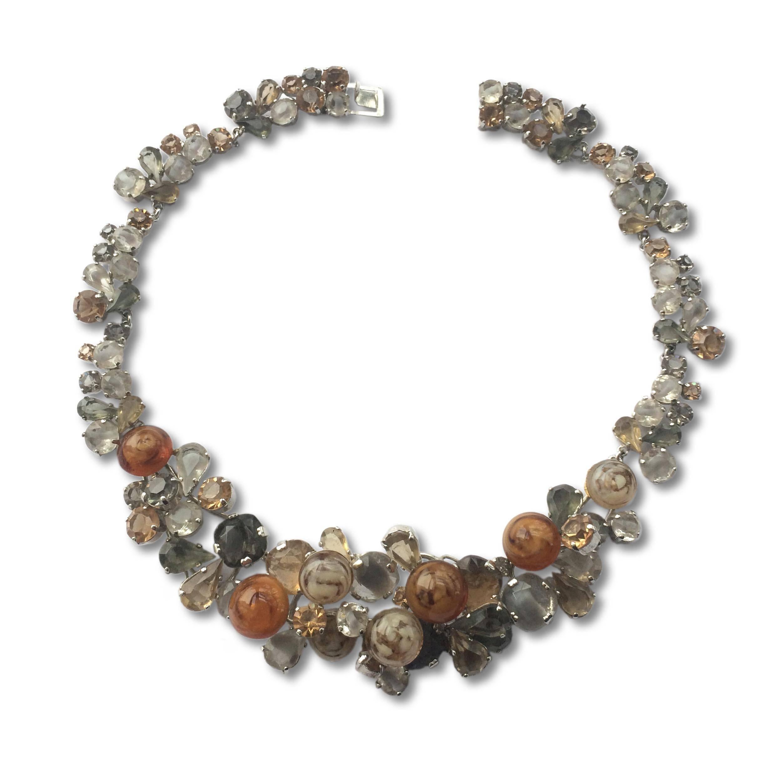 A wonderful necklace from Christian Dior, 1958 being the first year of Yves Saint Laurent installed as head designer. Made from unusual 'marbled' glass cabuchons, and unusual cuts and colours of stones, unique to this collection, they form a melange