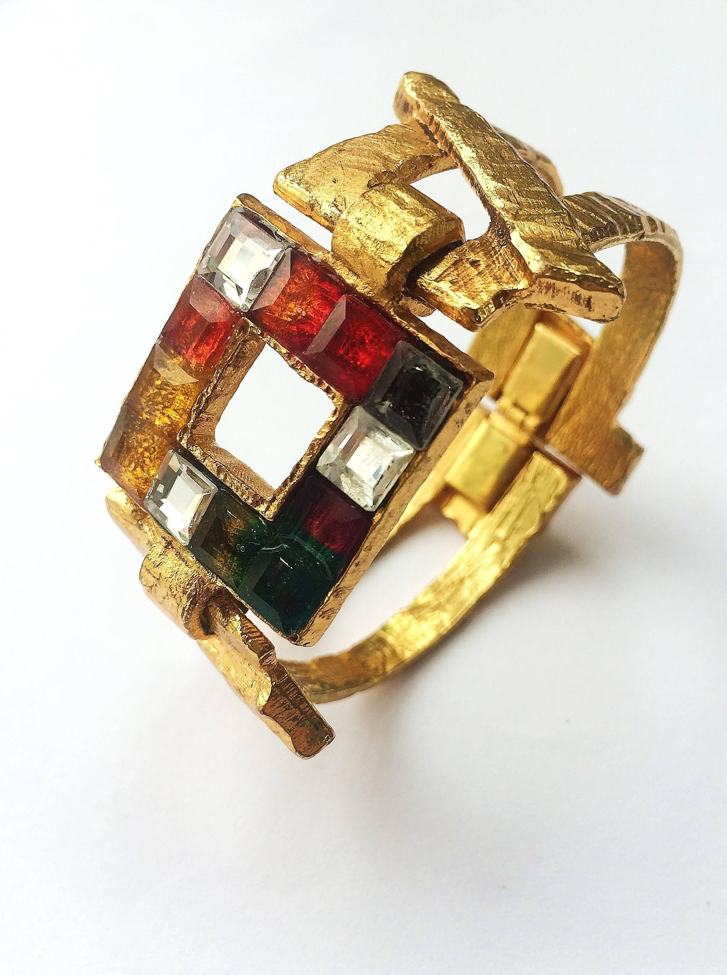 Sculptural and dynamic mosaic glass bracelet, with hammered gilt detail and fittings.
Christian Lacroix was  born in the south of France in 1951 and studied historical costume before working as a theatrical costumier.
He opened his own haute